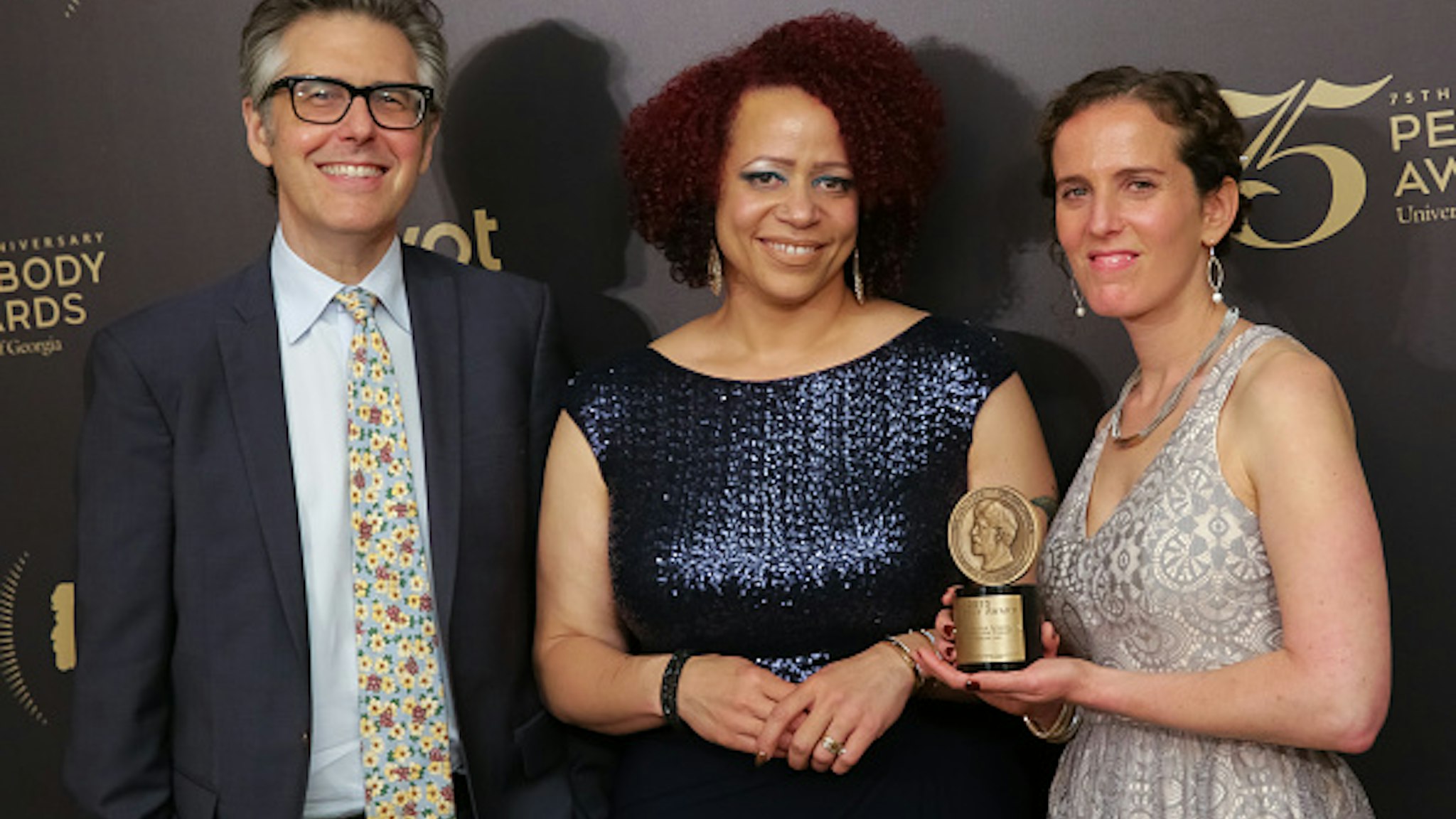 NEW YORK, NY - MAY 21: Official recipients for "The Case for School Desegregation Today-This American Life", (L-R) host and executive producer Ira Glass, reporter Nikole Hannah-Jones and producer Chana Joffe-Walt pose for photographs in the press room during the 75th Annual Peabody Awards Ceremony held at Cipriani Wall Street on May 21, 2016 in New York City.