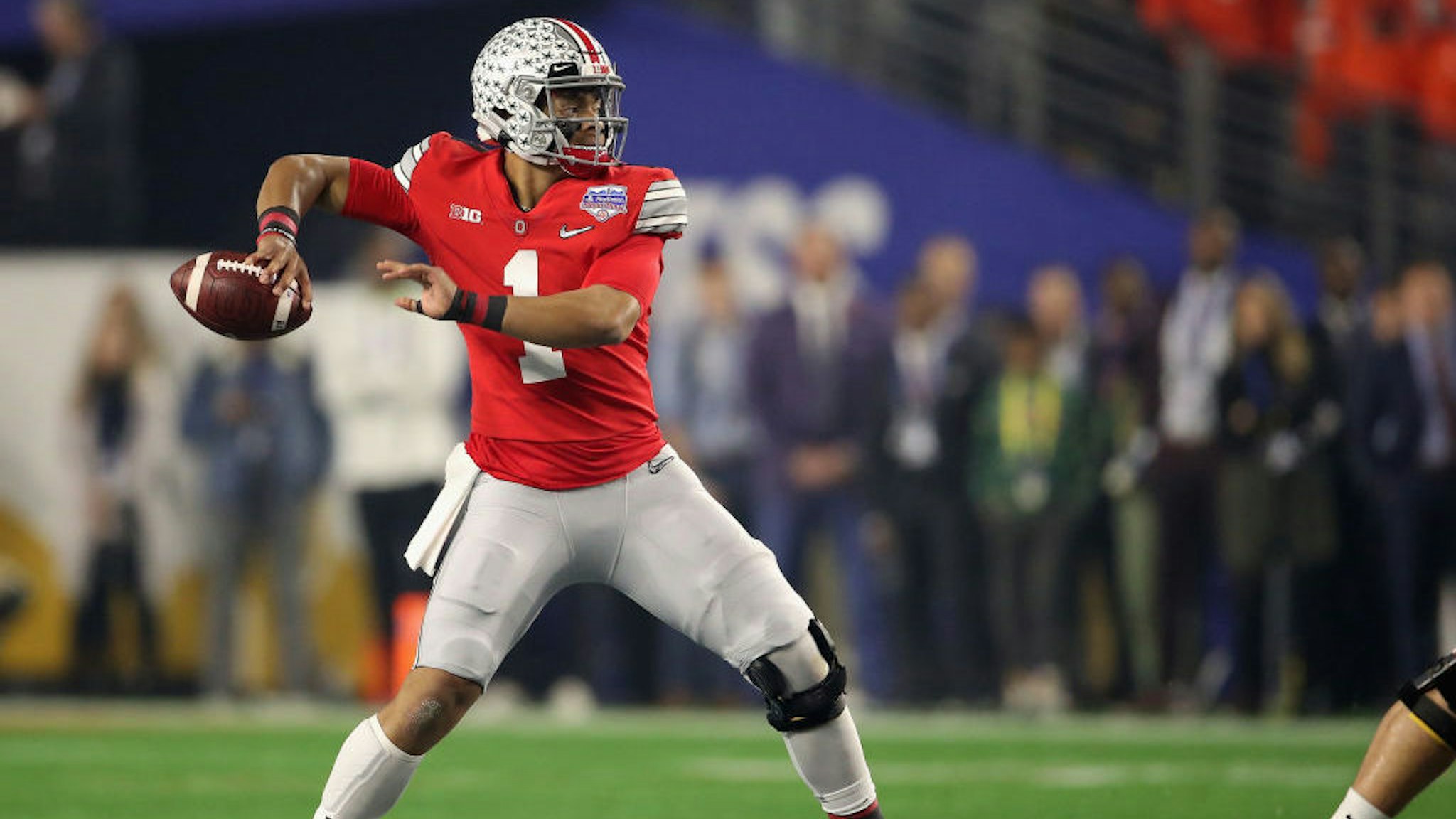 GLENDALE, ARIZONA - DECEMBER 28: Quarterback Justin Fields #1 of the Ohio State Buckeyes throws a pass during the PlayStation Fiesta Bowl against the Clemson Tigers at State Farm Stadium on December 28, 2019 in Glendale, Arizona. The Tigers defeated the Buckeyes 29-23. (Photo by Christian Petersen/Getty Images)