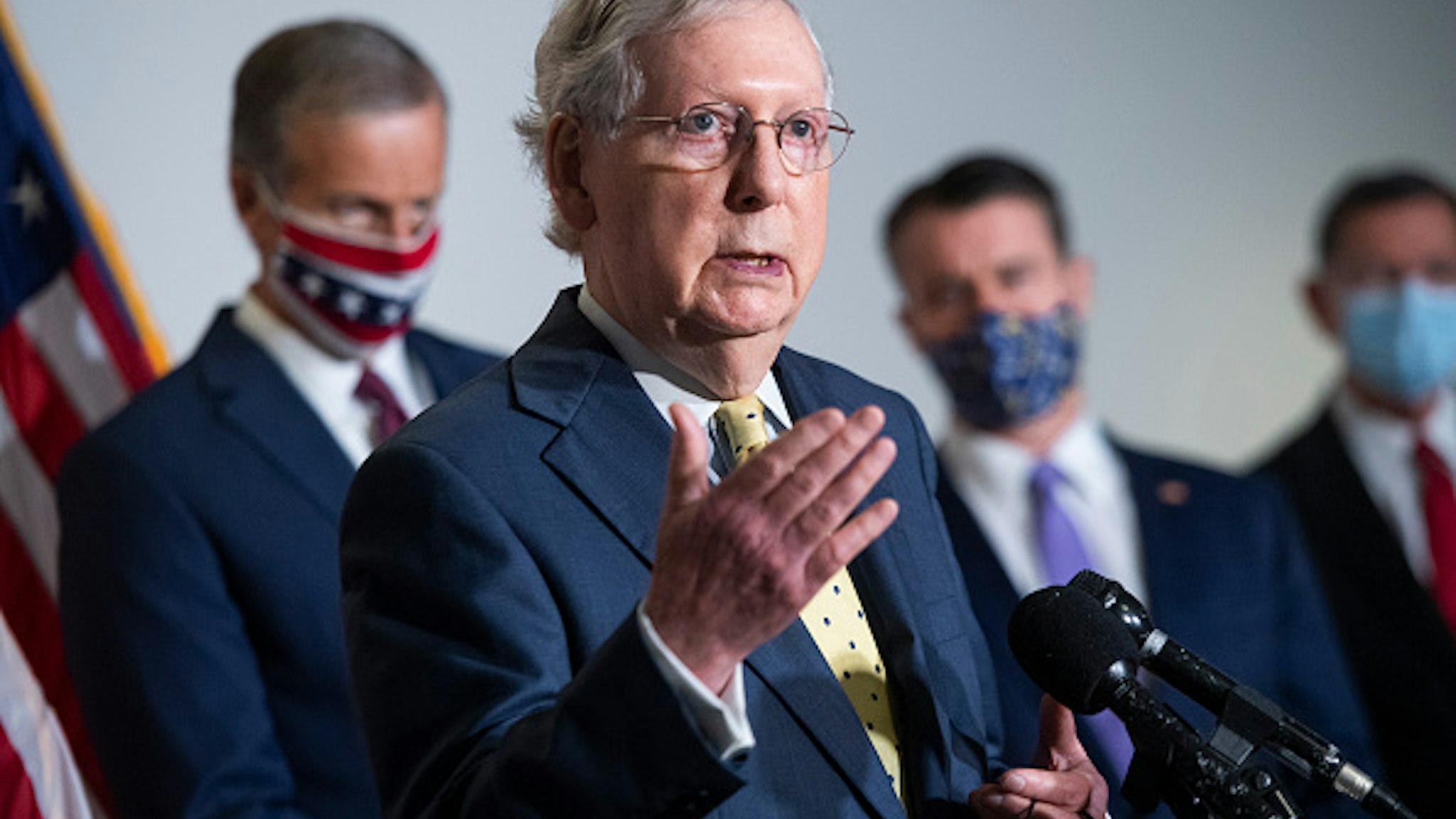 UNITED STATES - SEPTEMBER 9: Senate Majority Leader Mitch McConnell, R-Ky., conducts a news conference after the Senate Republican Policy luncheon in Hart Building on Wednesday, September 9, 2020. Also appearing from left are, Sens. John Thune, R-S.D., Todd Young, R-Ind., and John Barrasso, R-Wyo.