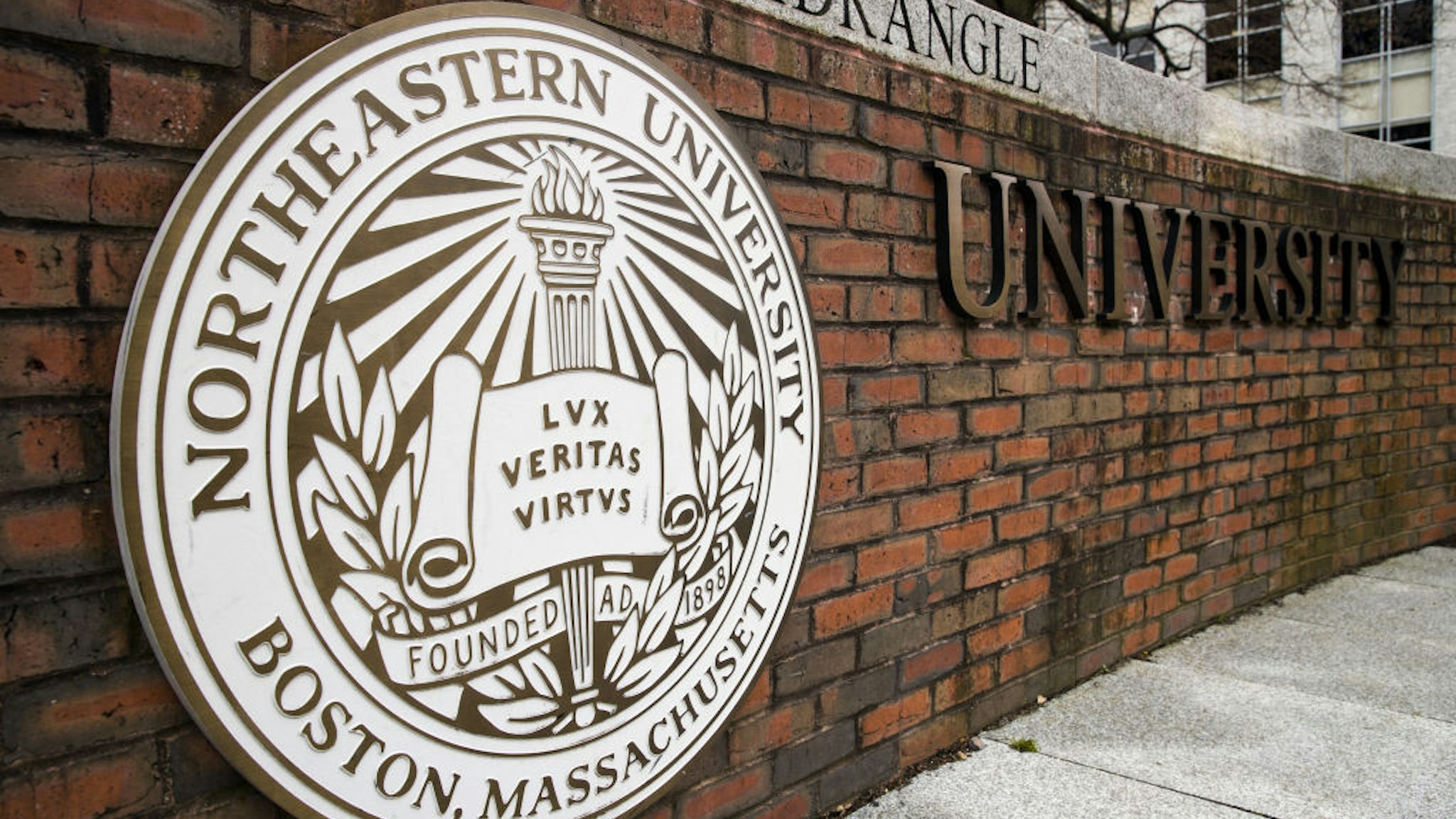 Signage is displayed at Northeastern University in Boston, Massachusetts, U.S., on Monday, April 20, 2020. College financial aid offices are bracing for a spike in appeals from students finding that the aid packages they were offered for next year are no longer enough after the coronavirus pandemic cost their parents jobs or income.