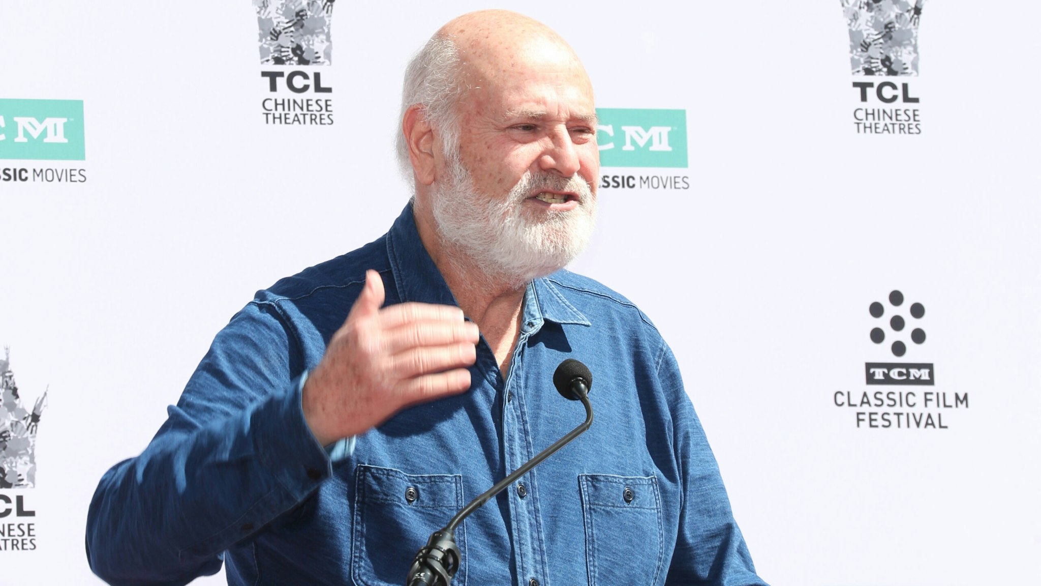 HOLLYWOOD, CALIFORNIA - APRIL 12: Comedian Rob Reiner speaks at a ceremony honoring Billy Crystal (out of frame) at TCL Chinese Theatre IMAX on April 12, 2019 in Hollywood, California.