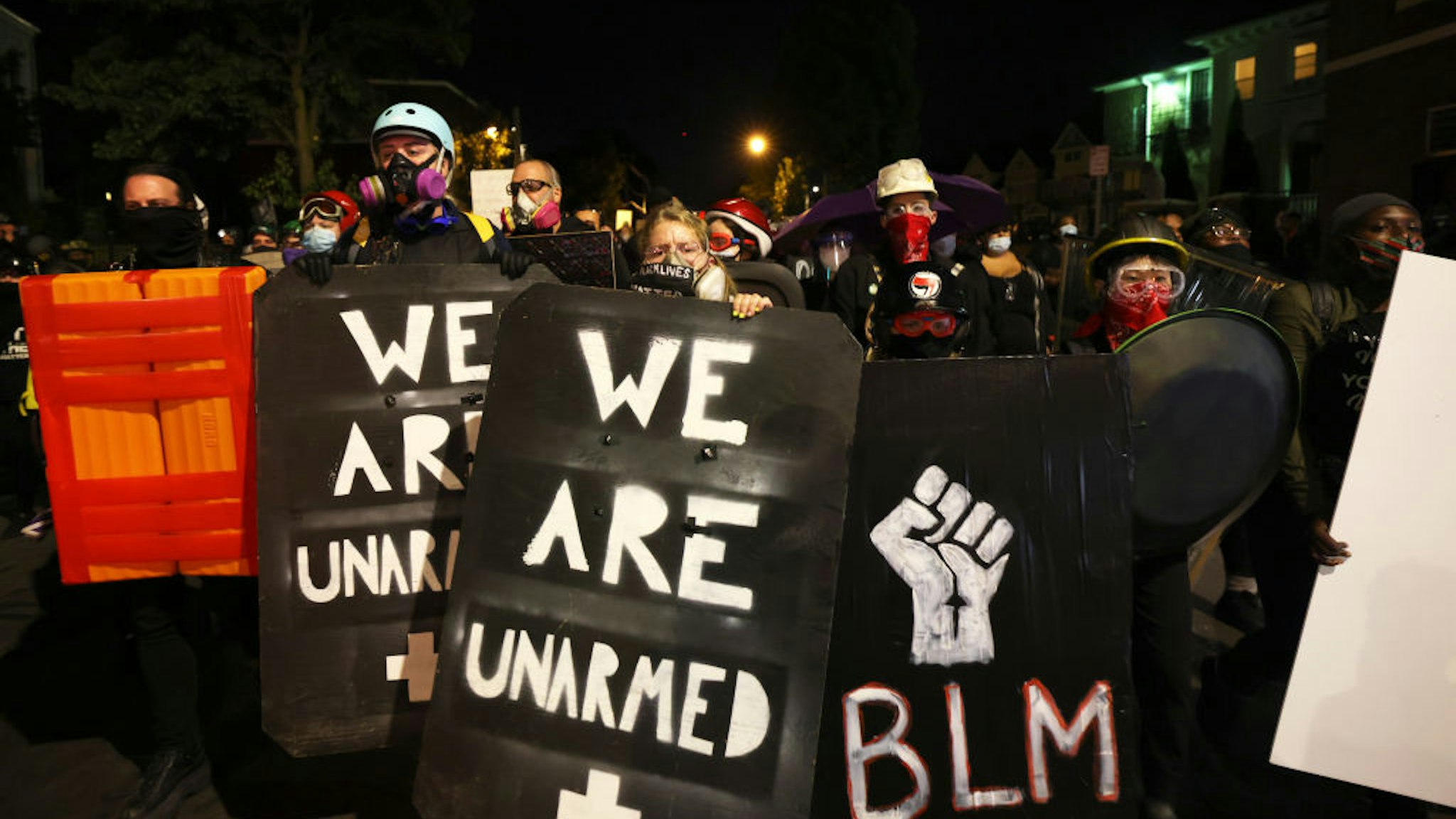 ROCHESTER, NEW YORK - SEPTEMBER 06: Demonstrators hold up homemade shields as they march towards the Public Safety building for Daniel Prude on September 06, 2020 in Rochester, New York. Prude died after being arrested on March 23 by Rochester police officers who had placed a "spit hood" over his head and pinned him to the ground while restraining him. This is the fifth consecutive night of protesting since the family released bodycam footage of Mr. Prude's arrest. (Photo by Michael M. Santiago/Getty Images)