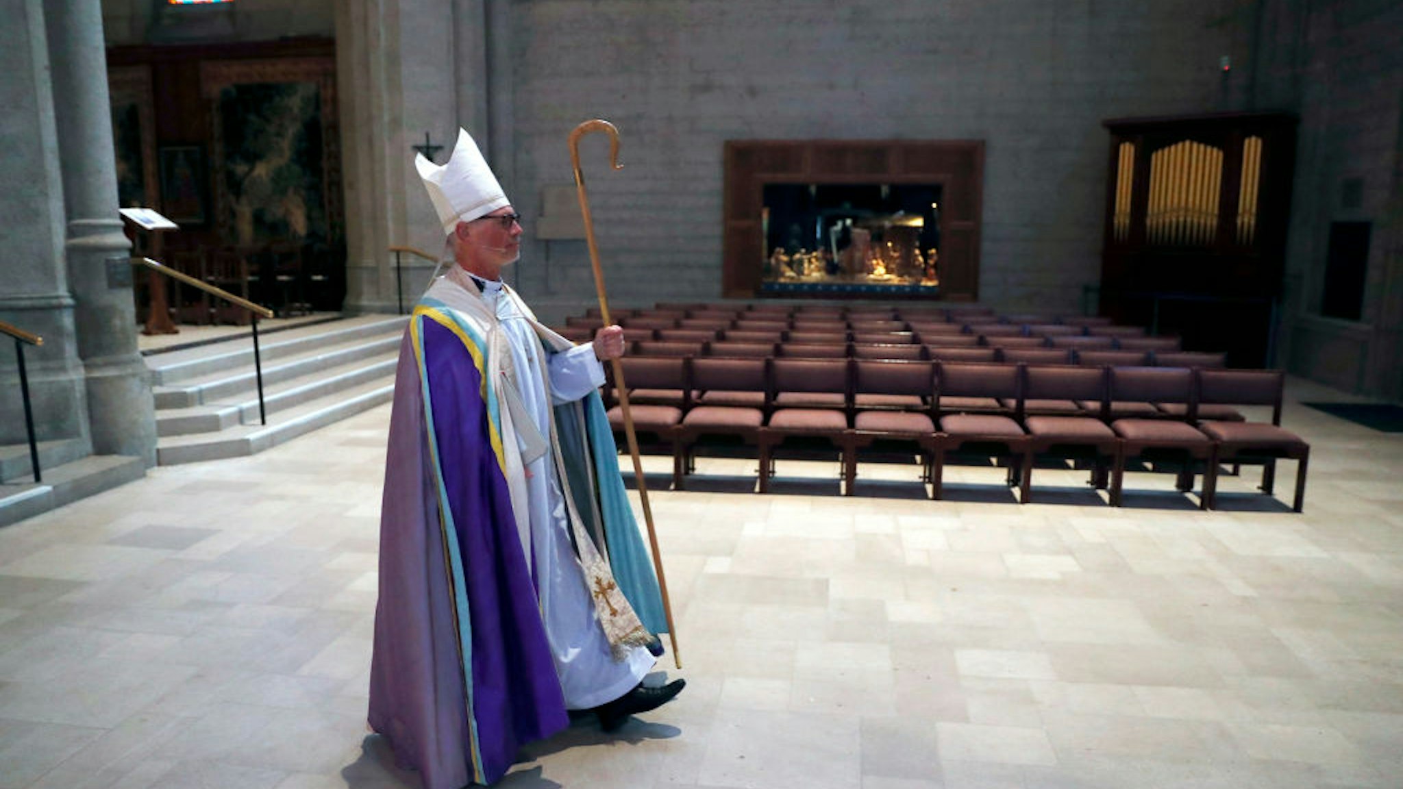 SAN FRANCISCO, CA - APRIL 12: Bishop Marc Andrus processes to altar during virtual Easter Sunday service at an empty Grace Cathedral in San Francisco, Calif., on Sunday, April 12, 2020.