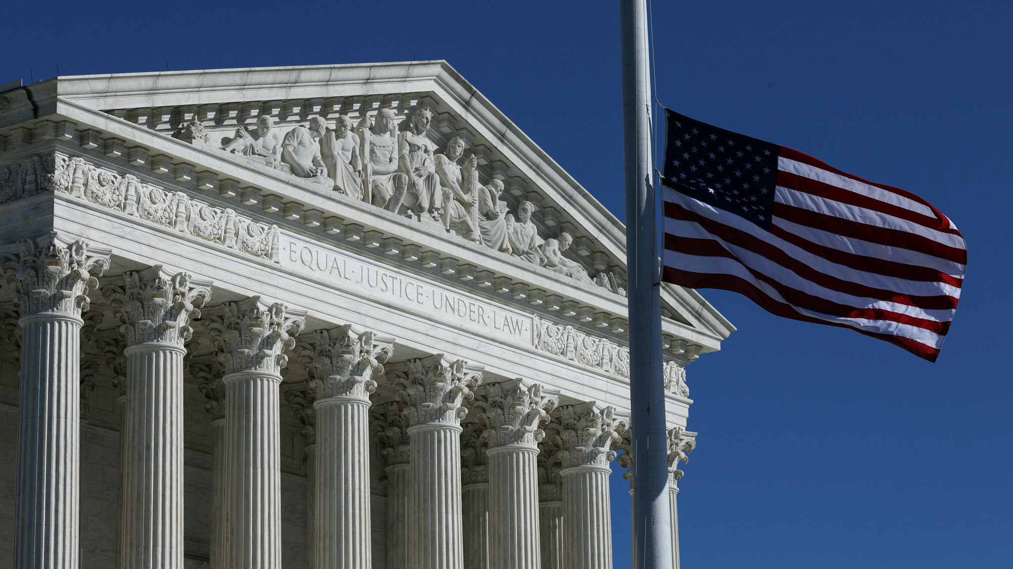 A U.S. flag is lowered to half-mast outside of the U.S. Supreme Court to mourn the death of Supreme Court Justice Ruth Bader Ginsburg in Washington, United States on September 21, 2020. (Photo by Yasin Ozturk/Anadolu Agency via Getty Images)