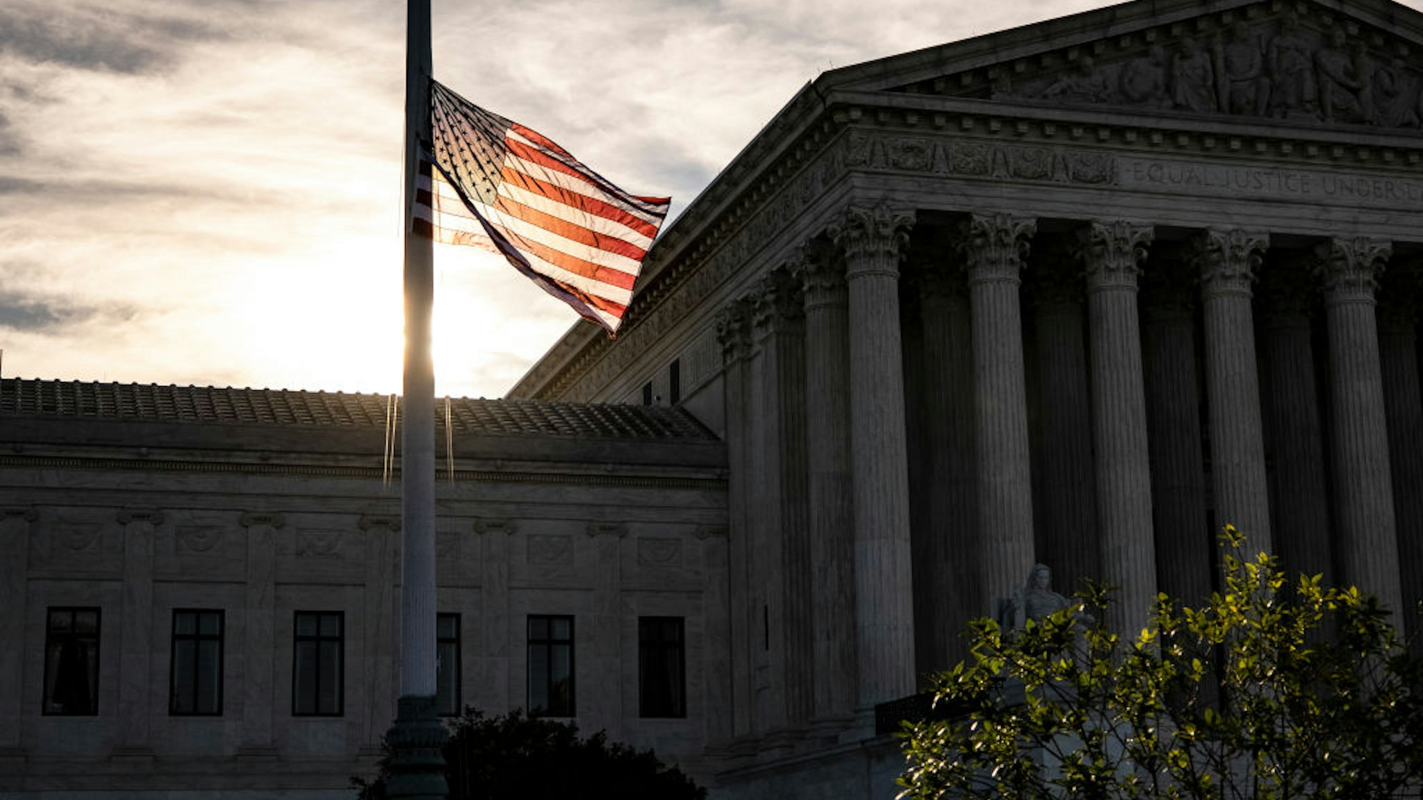 WASHINGTON, DC - SEPTEMBER 19: The American flag flies at half staff the morning after the death of Supreme Court Justice Ruth Bader Ginsburg in front of the US Supreme Court on September 19, 2020 in Washington, DC. Justice Ginsburg has died at age 87 after a battle with pancreatic cancer.
