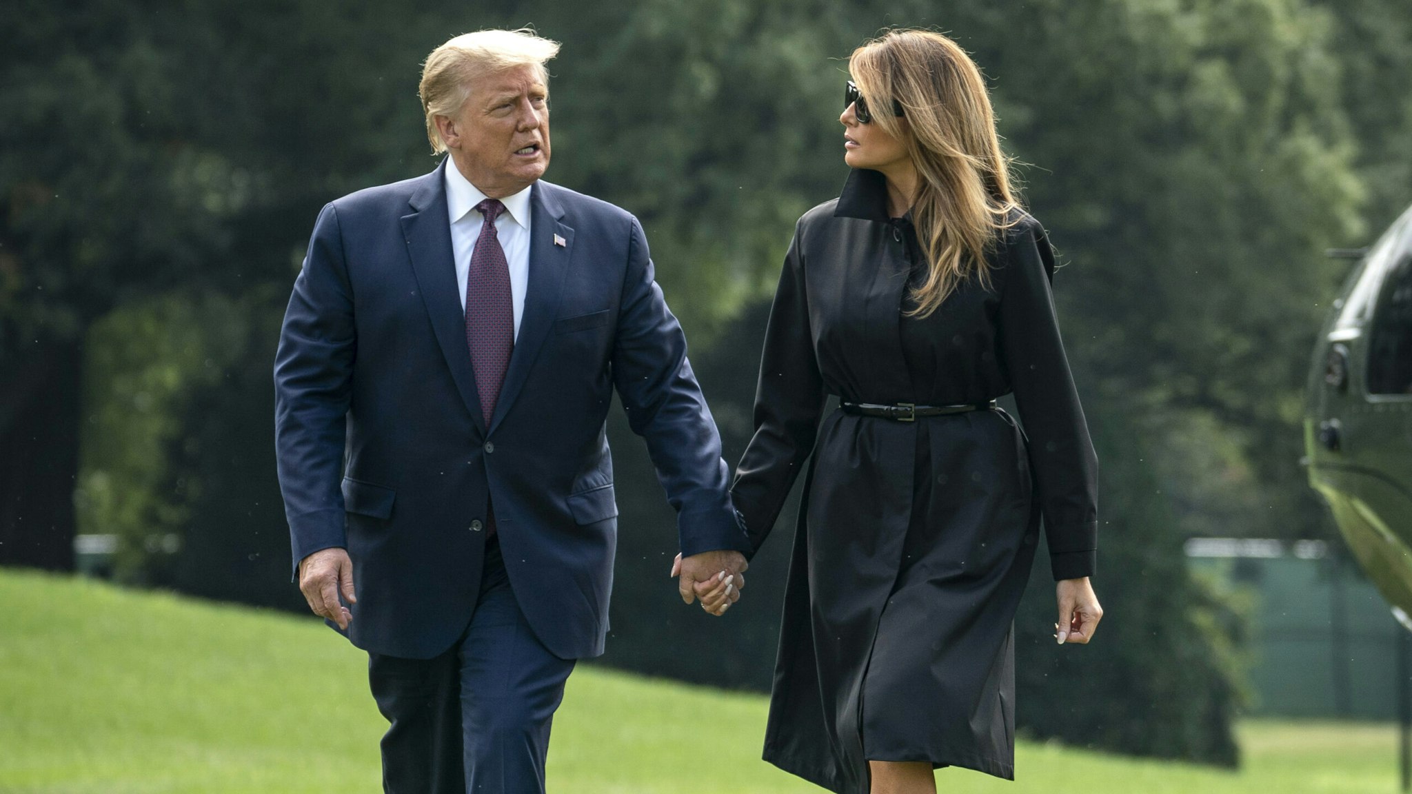 WASHINGTON, DC - SEPTEMBER 11: U.S. President Donald Trump and first lady Melania Trump walk to the White House residence as they exit Marine One on the South Lawn of the White House on September 11, 2020 in Washington, DC. President Trump and the First Lady traveled earlier to the Flight 93 National Memorial in Shanksville, Pennsylvania to mark the 19th anniversary of the September 11th attacks.