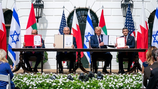 WASHINGTON, USA - SEPTEMBER 15: (----EDITORIAL USE ONLY â MANDATORY CREDIT - "THE WHITE HOUSE / TIA DUFOUR / HANDOUT" - NO MARKETING NO ADVERTISING CAMPAIGNS - DISTRIBUTED AS A SERVICE TO CLIENTS----) U.S. President Donald Trump (2nd R), Israeli Prime Minister Benjamin Netanyahu (2nd L), UAE Foreign Minister Abdullah bin Zayed Al Nahyan (R) and Bahrain Foreign Minister Abdullatif bin Rashid Al Zayani (L) attend a signing ceremony for the agreements on "normalization of relations" reached between Israel, the United Arab Emirates (UAE) and Bahrain at the White House in Washington, United States on September 15, 2020. (Photo by The White House / Tia Dufour / Handout/Anadolu Agency via Getty Images)
