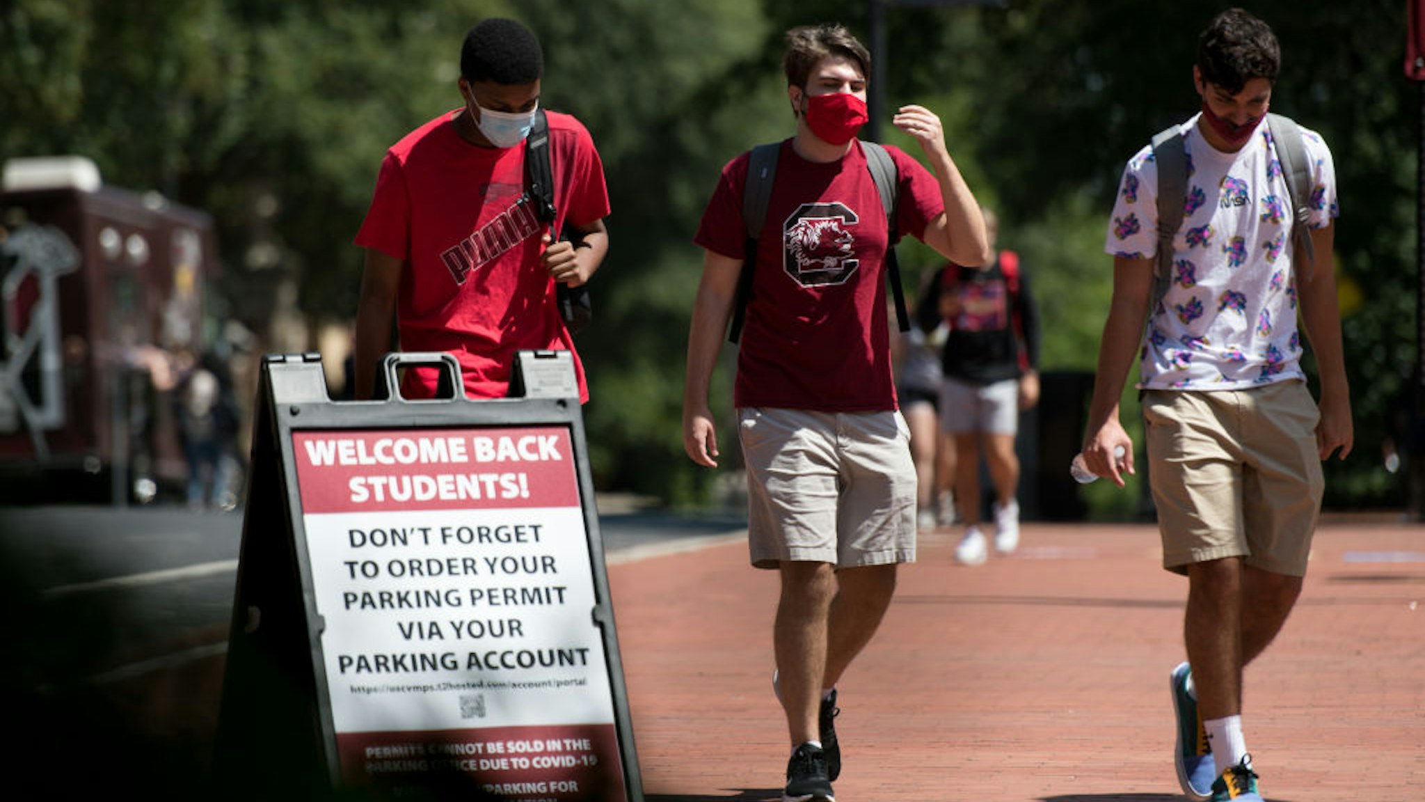 COLUMBIA, SC - SEPTEMBER 03: Students walk on campus at the University of South Carolina on September 3, 2020 in Columbia, South Carolina. During the final week of August, the university reported a 26.6 percent positivity rate among the student population tested for the COVID-19 virus. (Photo by Sean Rayford/Getty Images)