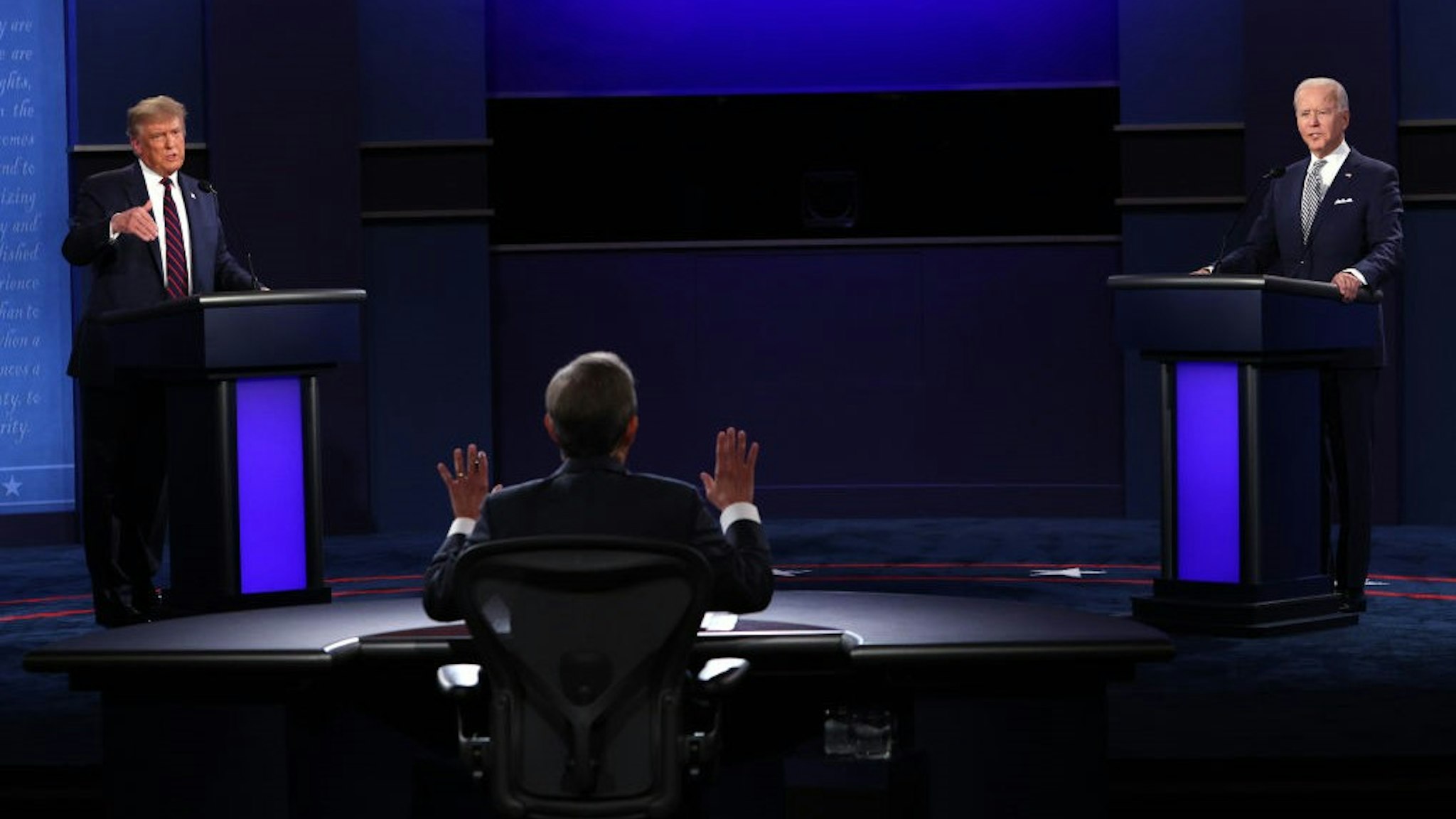 CLEVELAND, OHIO - SEPTEMBER 29: U.S. President Donald Trump and Democratic presidential nominee Joe Biden participate in the first presidential debate moderated by Fox News anchor Chris Wallace (C) at the Health Education Campus of Case Western Reserve University on September 29, 2020 in Cleveland, Ohio. This is the first of three planned debates between the two candidates in the lead up to the election on November 3. (Photo by