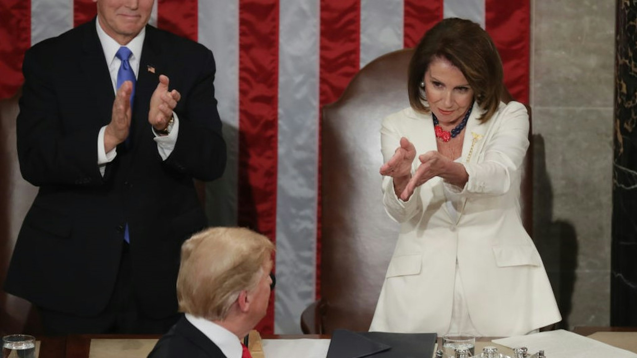 WASHINGTON, DC - FEBRUARY 05: Vice President Mike Pence and Speaker Nancy Pelosi greet President Donald Trump just ahead of the State of the Union address in the chamber of the U.S. House of Representatives at the U.S. Capitol Building on February 5, 2019 in Washington, DC. President Trump's second State of the Union address was postponed one week due to the partial government shutdown. (Photo by