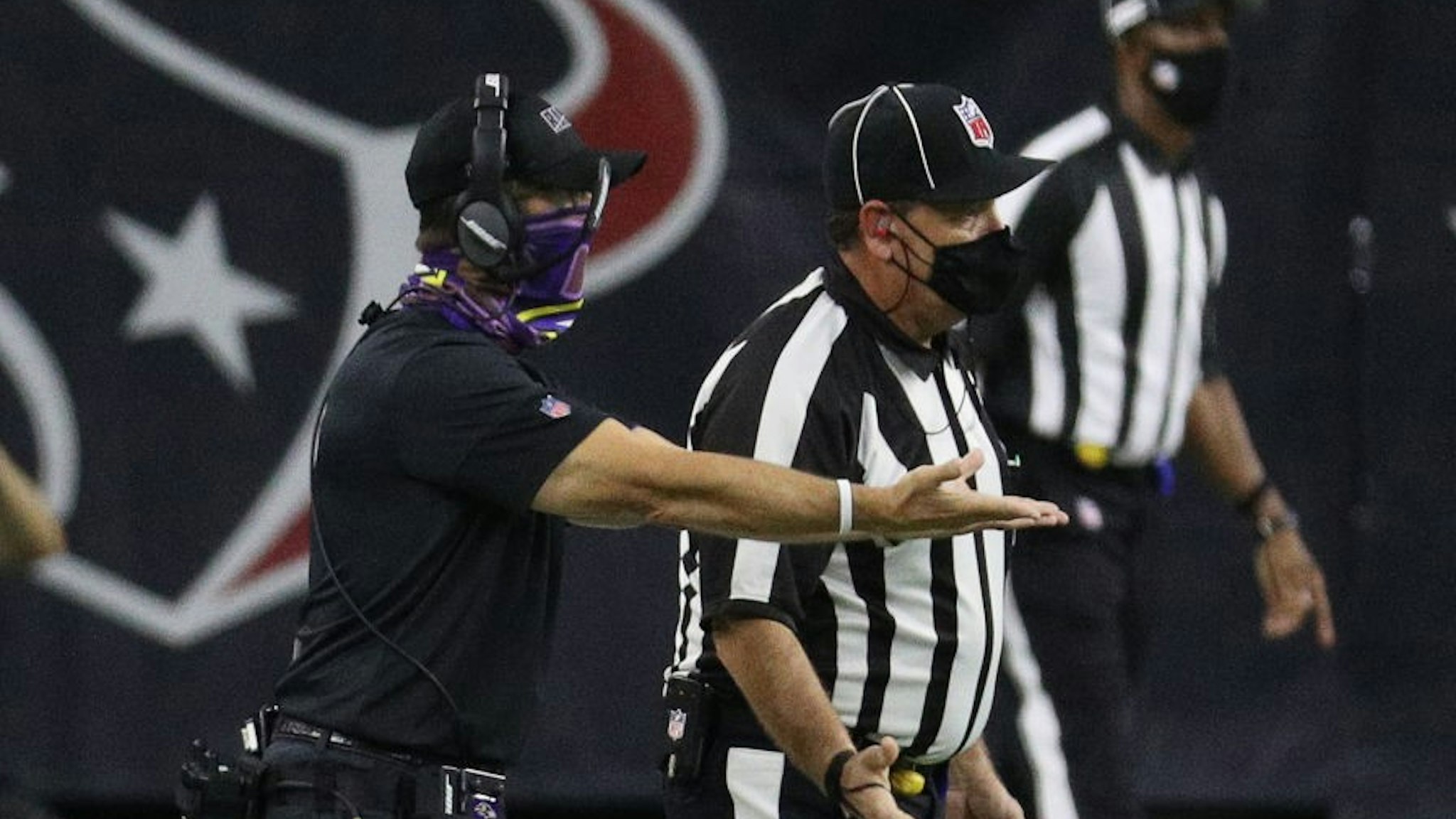 HOUSTON, TEXAS - SEPTEMBER 20: Head coach John Harbaugh of the Baltimore Ravens argues with the official after extra time was put back on the clock and Houston Texans kicked a field goal at NRG Stadium on September 20, 2020 in Houston, Texas. (Photo by