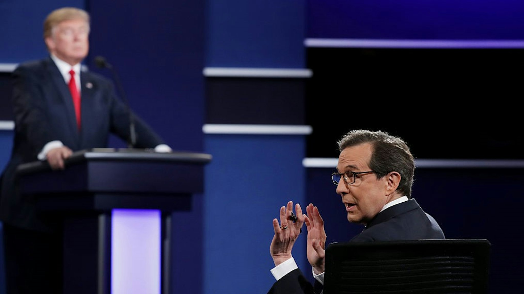 LAS VEGAS, NV - OCTOBER 19: Fox News anchor and moderator Chris Wallace quiets the audience during the third U.S. presidential debate at the Thomas &amp; Mack Center on October 19, 2016 in Las Vegas, Nevada. Tonight is the final debate ahead of Election Day on November 8. (Photo by