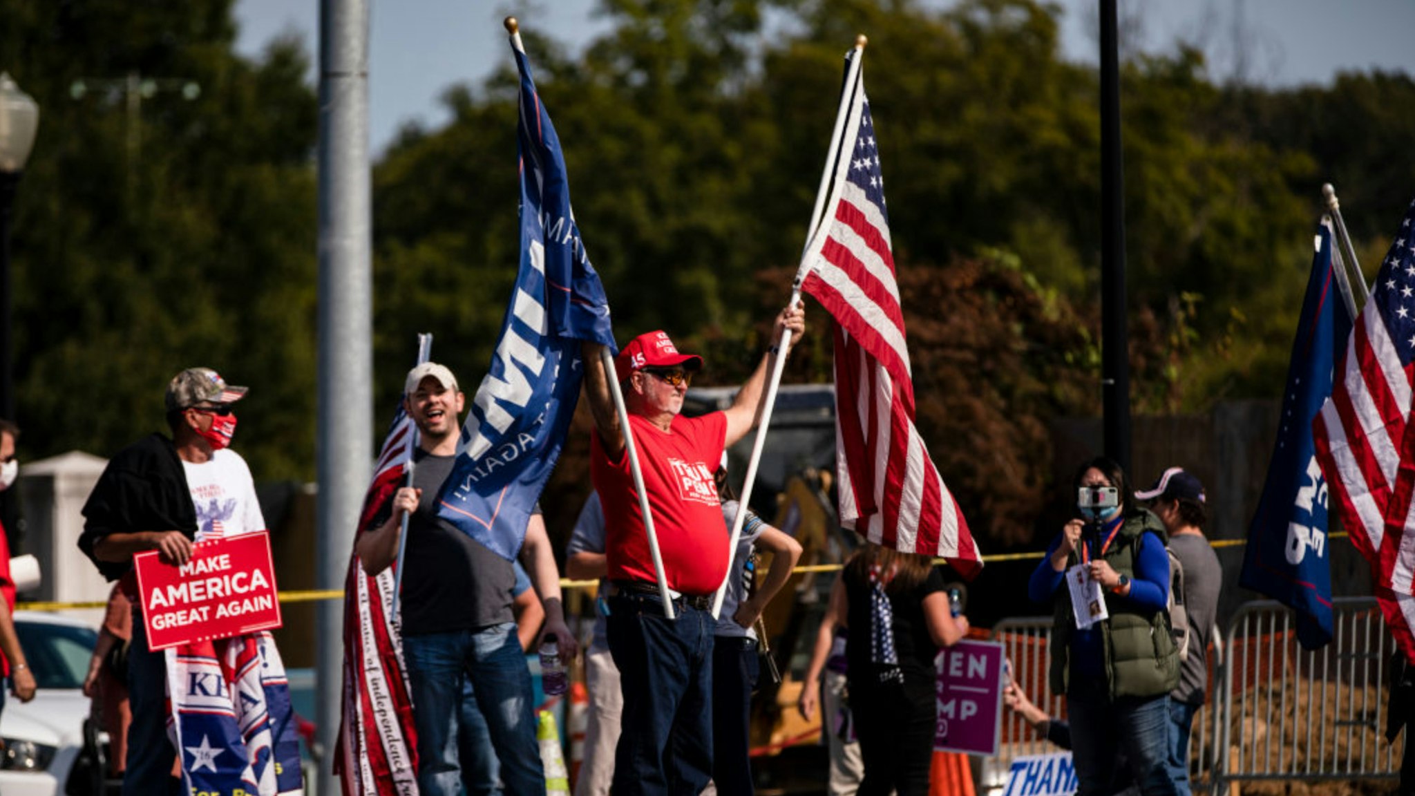 Supporters of President Donald Trump gather outside of Walter Reed National Military Medical Center after the President was admitted for treatment of COVID-19 on October 4, 2020 in Bethesda, Maryland.