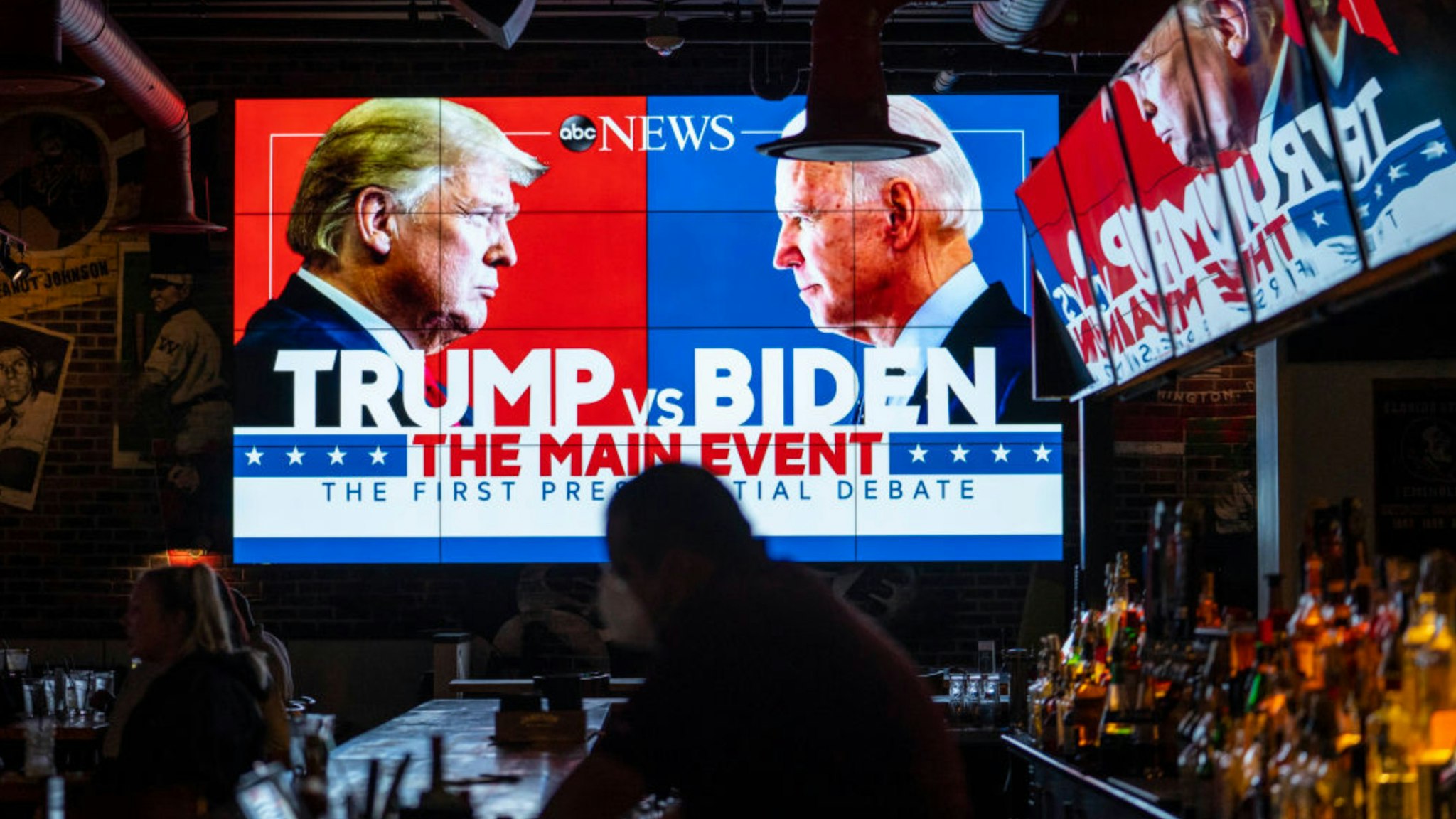Television screens airing the first presidential debate are seen at Walters Sports Bar on September 29, 2020 in Washington, United States.
