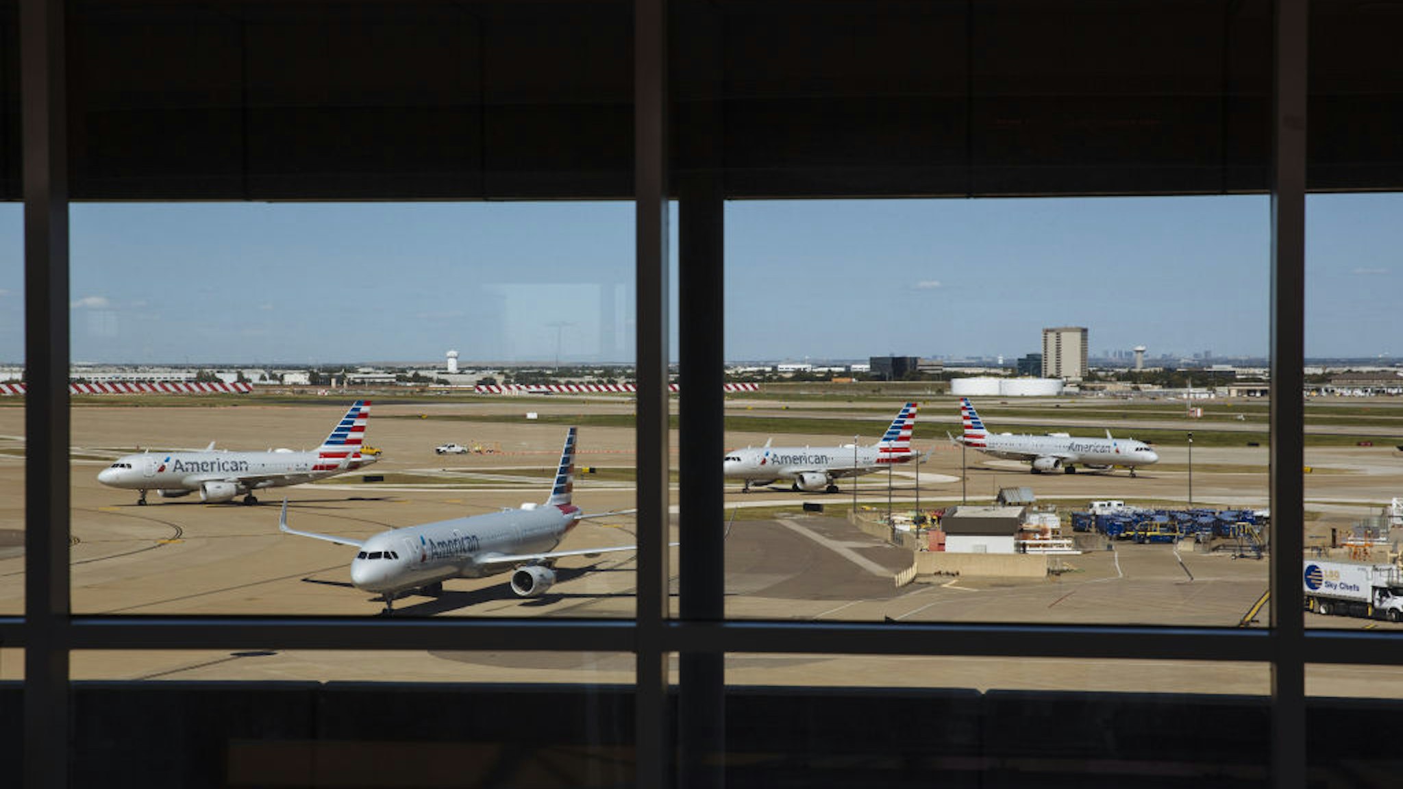 American Airlines planes sit on the tarmac at Dallas/Fort Worth International Airport (DFW) in Dallas, Texas, U.S., on Monday, Sept. 28, 2020. Airline passenger numbers in the U.S. totaled 797,699 on Sept. 28, compared with 2.37 million the same weekday a year earlier, according to the Transportation Security Administration.