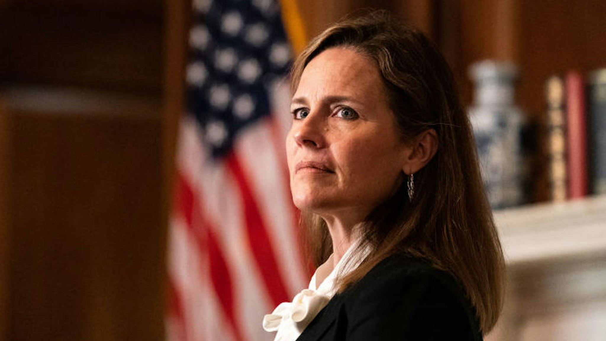 Amy Coney Barrett, U.S. President Donald Trump's nominee for associate justice of the U.S. Supreme Court, meets with Senator Jerry Moran, a Republican from Kansas, not pictured, at the U.S. Capitol in Washington, D.C., U.S., on Thursday, Oct. 1, 2020. A bruising Senate confirmation fight over Trump's Supreme Court choice may seal the fates of several incumbent senators in the November election, though it has yet to drastically alter the odds for which party will control the chamber. Photographer: Anna Moneymaker/The New York Times/Bloomberg