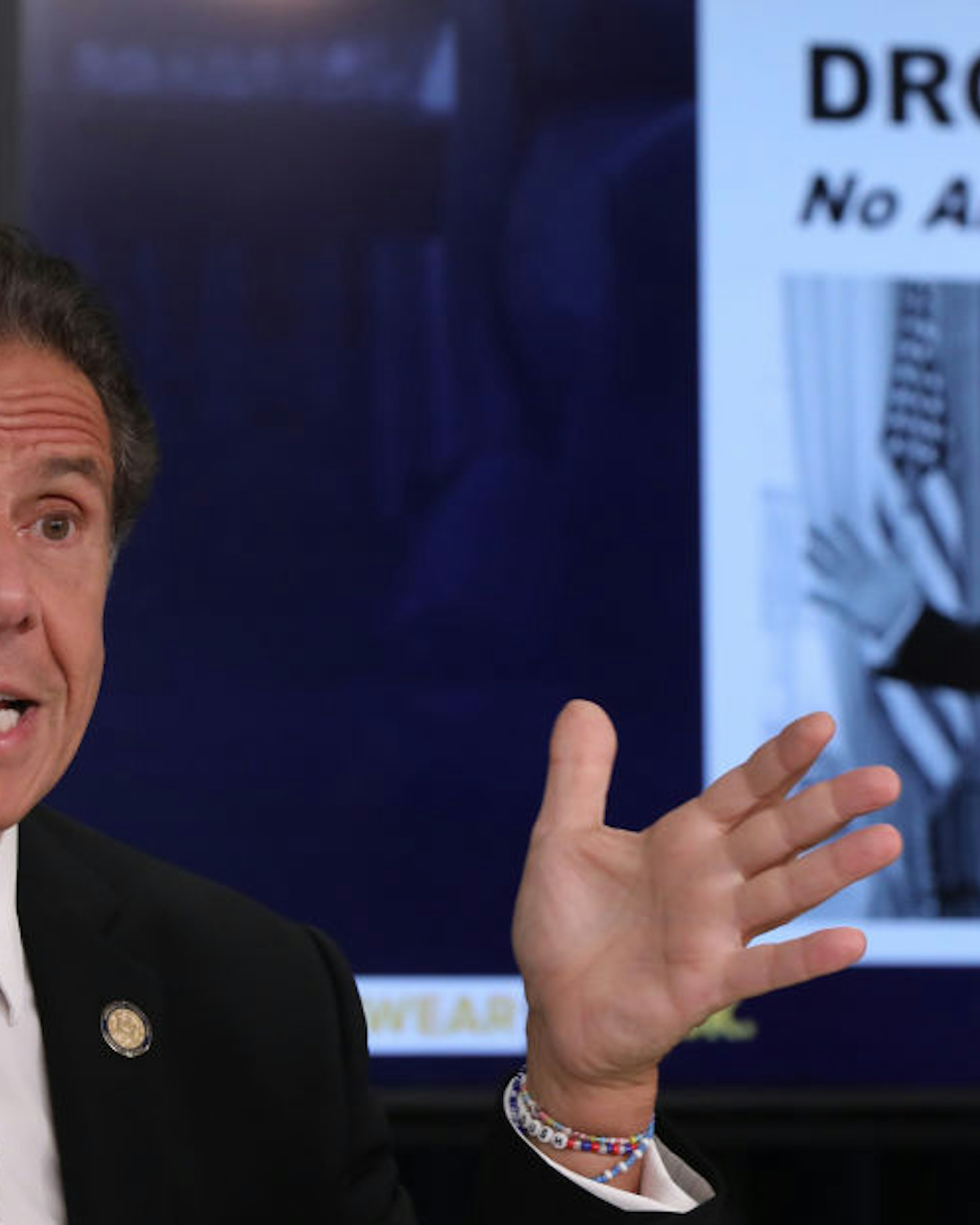 A mock up of a newspaper headline and photo of U.S. President Donald Trump is displayed on a screen as New York state Gov. Andrew Cuomo criticizes Trump's handling of COVID-19 at a news conference on September 08, 2020 in New York City. Cuomo, though easing restrictions on casinos and malls throughout the state, has declined to do so for indoor dining in restaurants in New York City despite pressure from business owners, citing struggles by the city to enforce the state's previous orders. (Photo by Spencer Platt/Getty Images)
