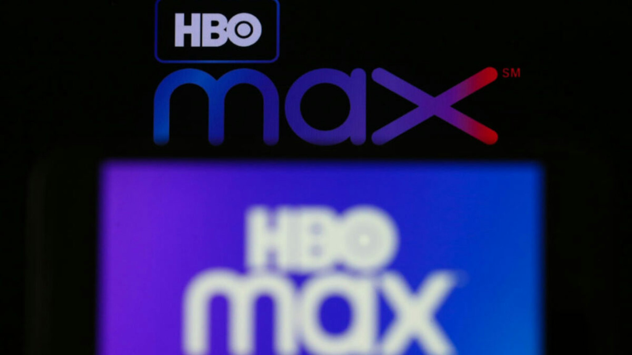 In this illustration photo HBO Max logos are displayed on a mobile phone and a laptop screen in Ankara, Turkey on June 1, 2020.
