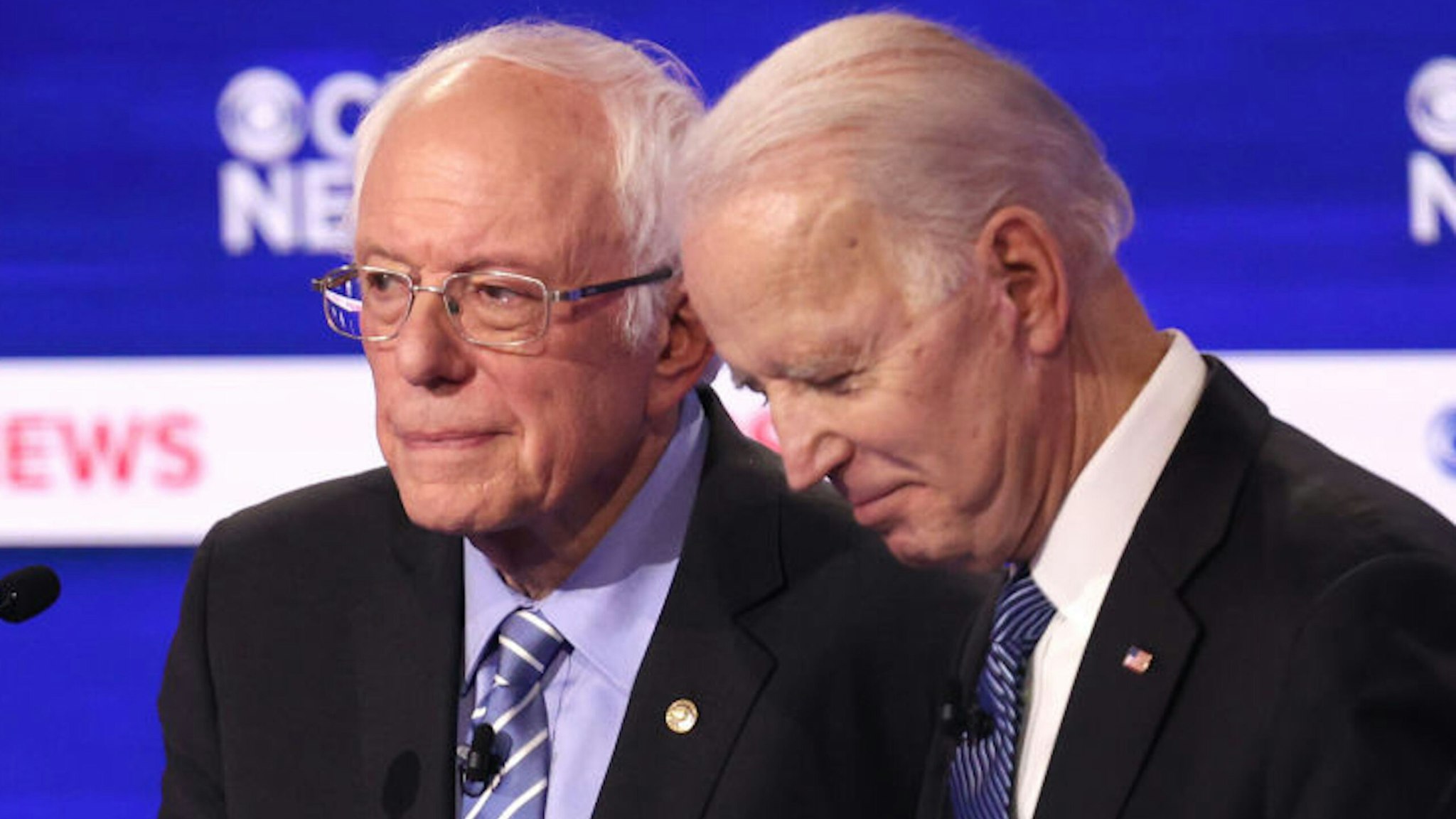 CHARLESTON, SOUTH CAROLINA - FEBRUARY 25: Democratic presidential candidates Sen. Bernie Sanders (I-VT) and former Vice President Joe Biden speak during a break at the Democratic presidential primary debate at the Charleston Gaillard Center on February 25, 2020 in Charleston, South Carolina. Seven candidates qualified for the debate, hosted by CBS News and Congressional Black Caucus Institute, ahead of South Carolina‚Äôs primary in four days.