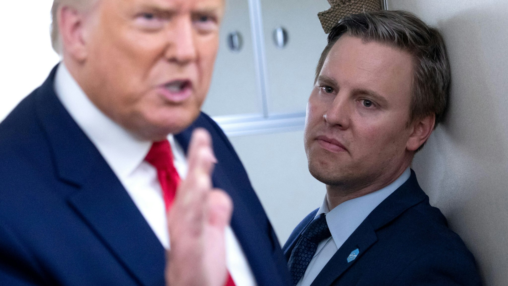 Campaign manager Bill Stepien stands alongside US President Donald Trump as he speaks with reporters aboard Air Force One as he flies from Manchester, New Hampshire to Joint Base Andrews in Maryland, August 28, 2020, following a campaign rally.