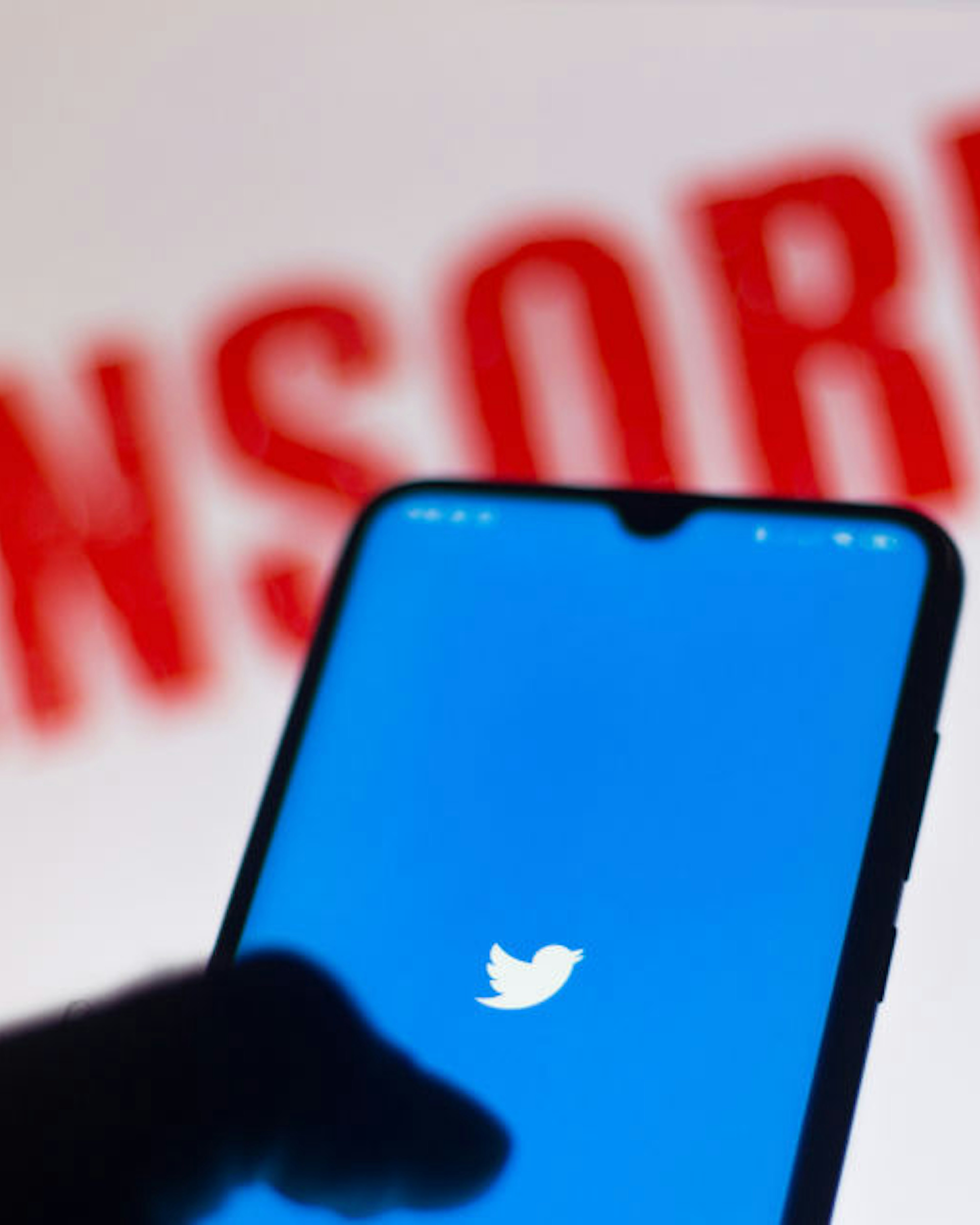 In this photo illustration the Twitter logo is displayed on a smartphone and a red alerting word "CENSORED" on the blurred background. (Photo Illustration by Rafael Henrique/SOPA Images/LightRocket via Getty Images)