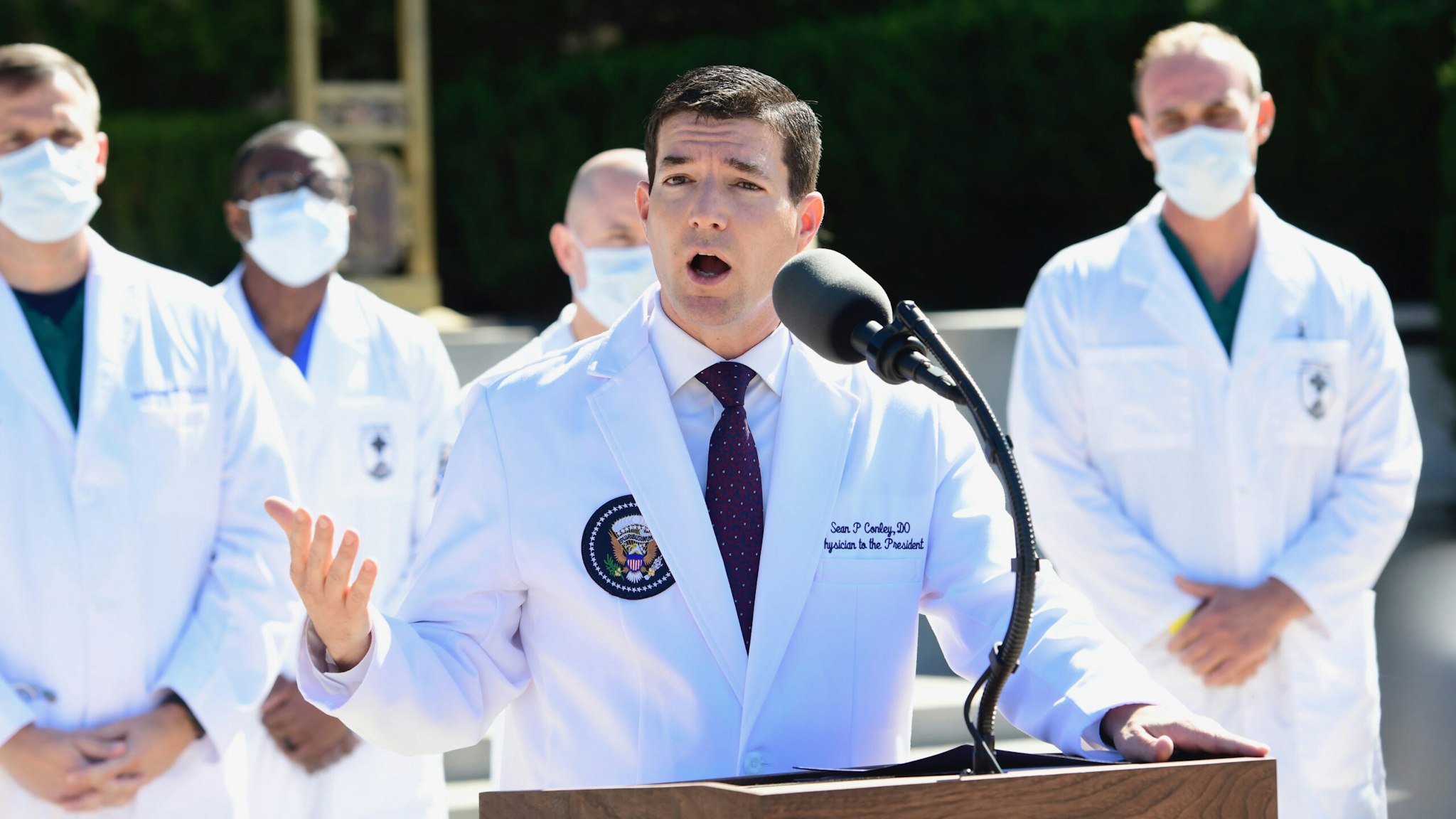 Dr. Sean Conley, White House physician, speaks during a press conference outside of Walter Reed National Military Medical Center in Bethesda, Maryland, U.S., on Saturday, Oct. 3, 2020. Dr. Conley said the president is "doing very well" and his condition is improving while being treated at the U.S. military hospital near Washington for Covid-19.