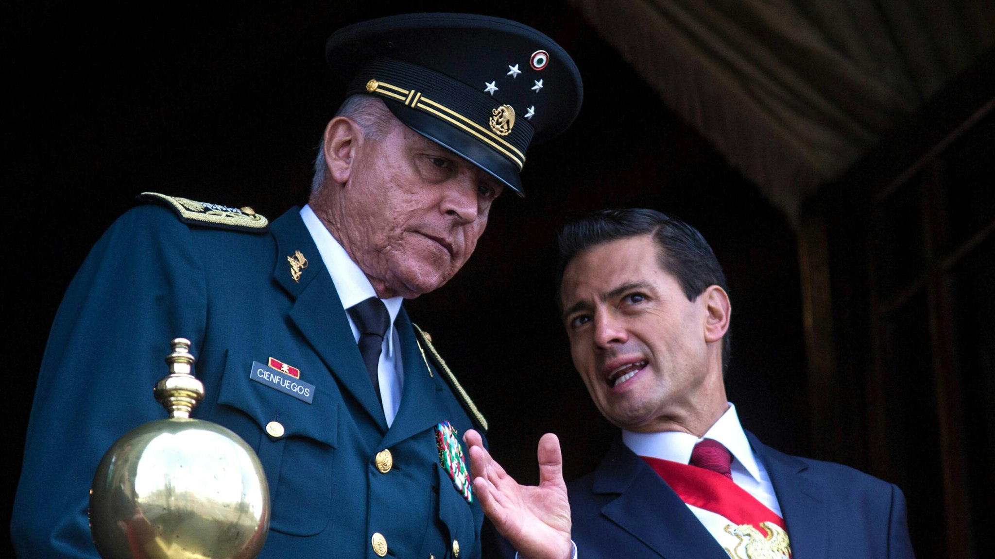 MEXICO CITY, MEXICO - SEPTEMBER 16 : President of Mexico Enrique Pena Nieto (R) and Defense Secretary Salvador Cienfuegos Zepeda watch the annual military parade at Zocalo main square, in Mexico City, Mexico on September 16, 2016. Mexico is marking the 206th anniversary of its independence.