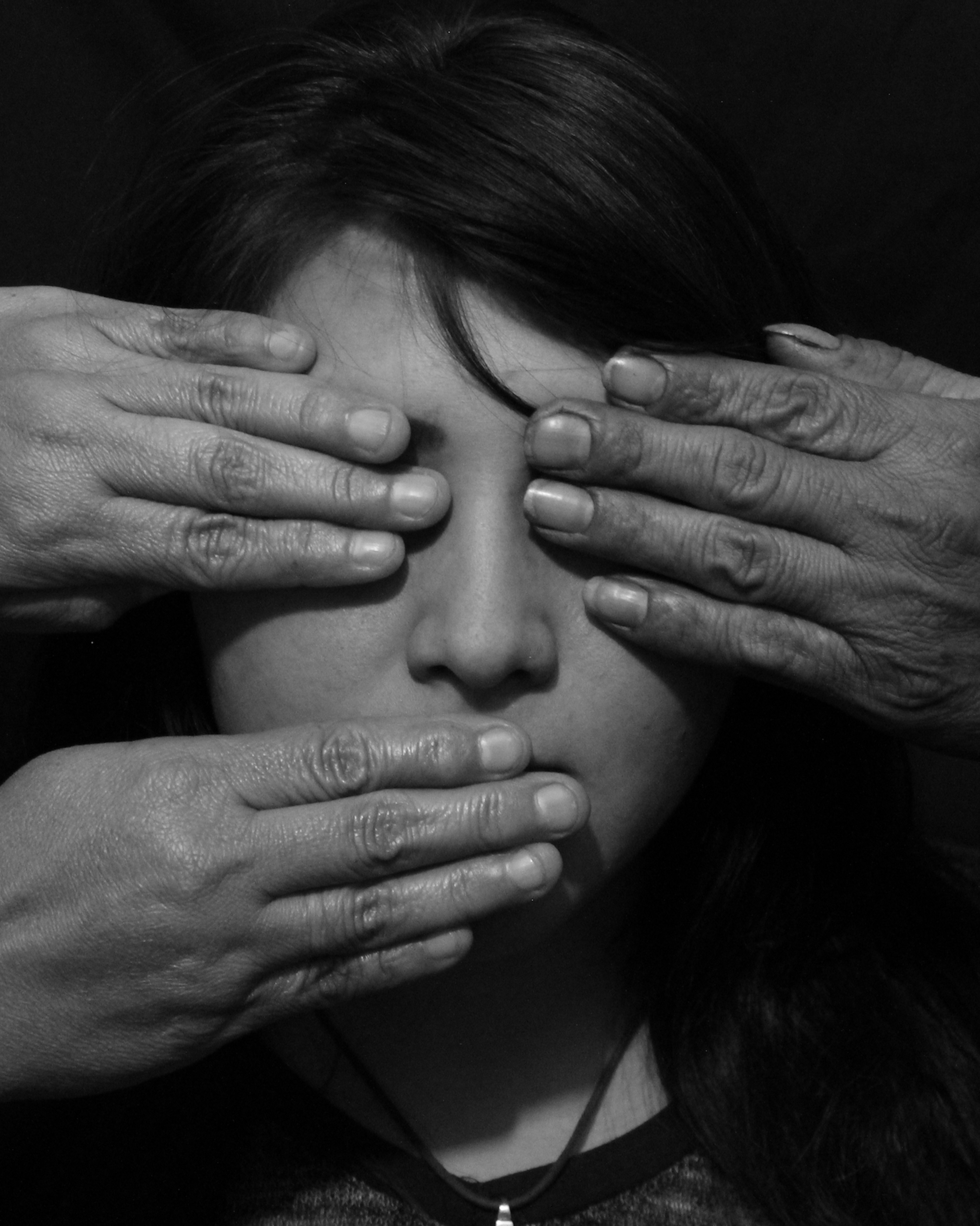 Close-Up Of A Hands On Womans Face