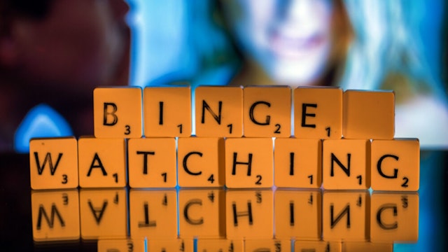 ILLUSTRATION - The English word "binge-watching" spelled out in Scrabble letters in Schwerin, Germany, 5 November 2015. The expression, describing continuous television viewing, was named word of the year by the British Collin's dictionary.