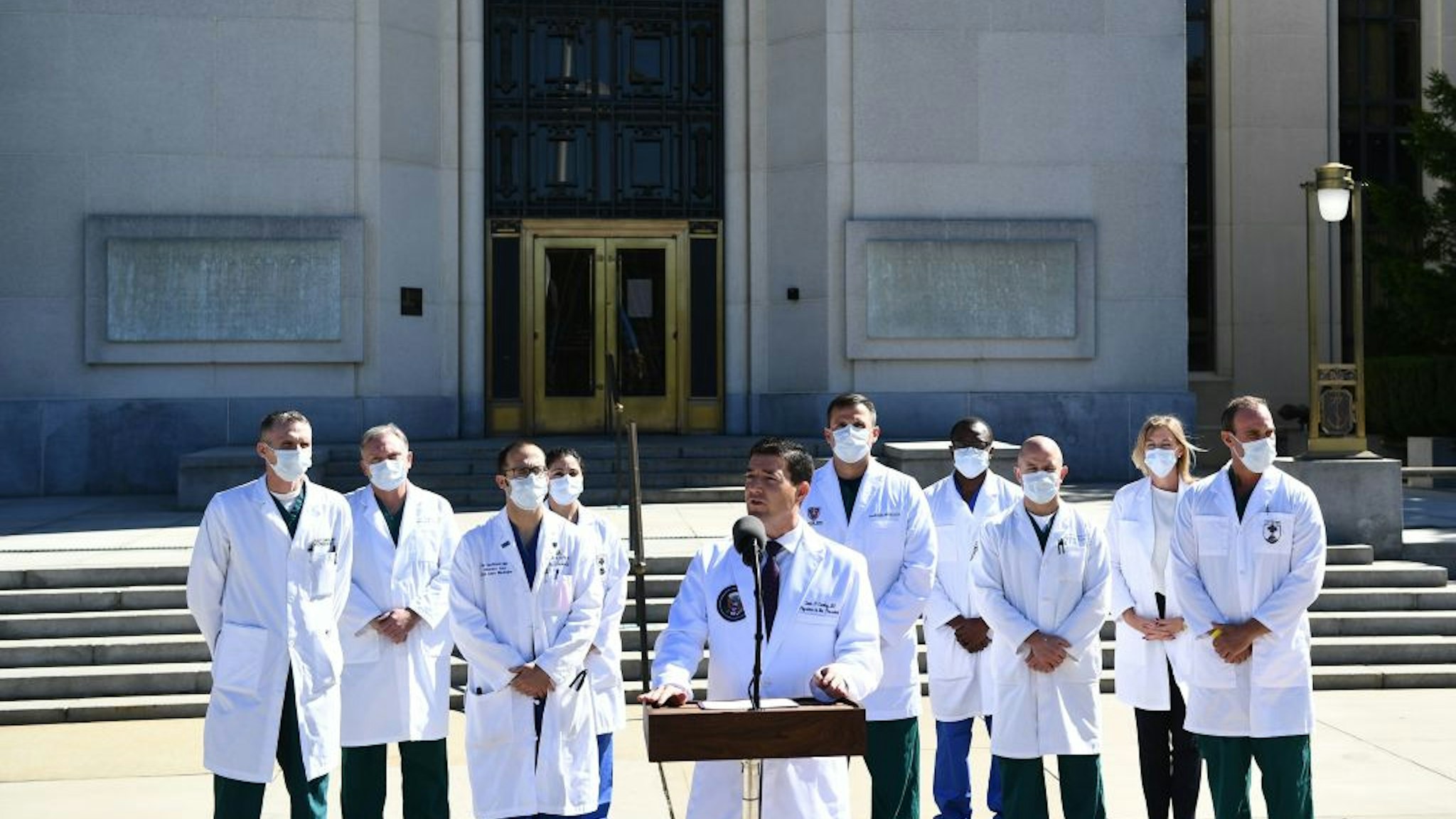 White House physician Sean Conley, with medical staff, gives an update on the condition of US President Donald Trump, on October 3, 2020, at Walter Reed Medical Center in Bethesda, Maryland.