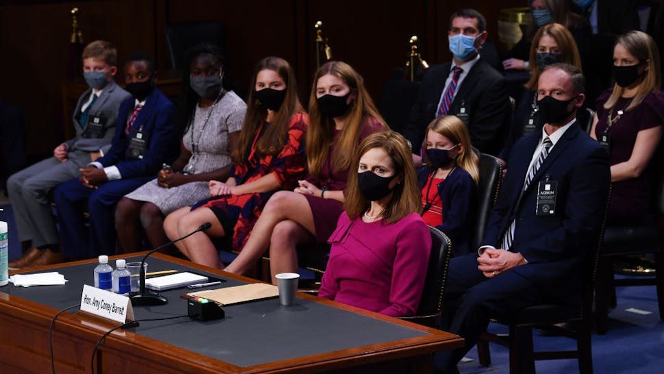 Senate Holds Confirmation Hearing For Amy Coney Barrett To Be Supreme Court Justice Supreme Court Justice nominee Judge Amy Coney Barrett sits near her family during the Senate Judiciary Committee confirmation hearing for Supreme Court Justice on Capitol Hill on October 12, 2020 in Washington, DC.