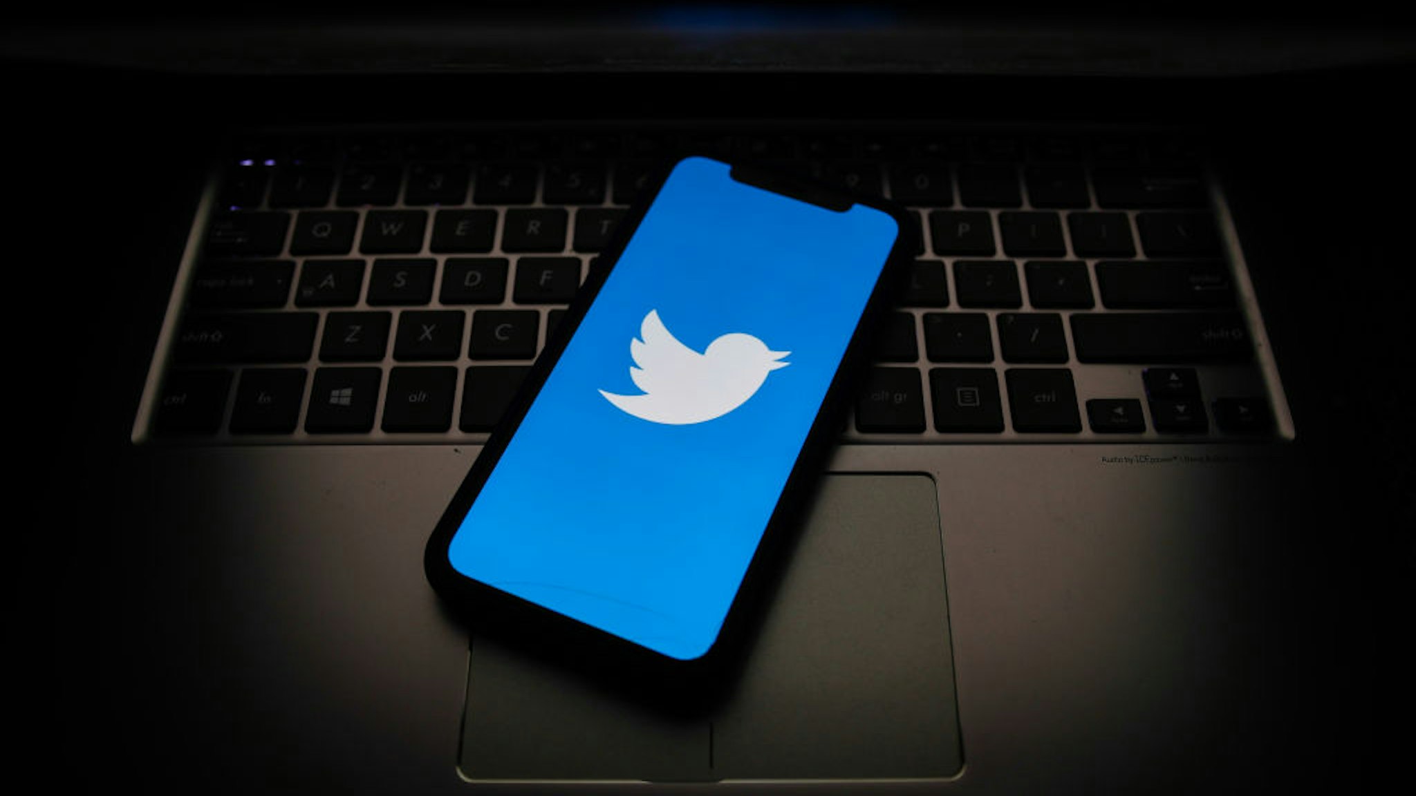 witter logo displayed on a phone screen is seen in this illustration photo taken on October 18, 2020. (Photo Illustration by Jakub Porzycki/NurPhoto via Getty Images)