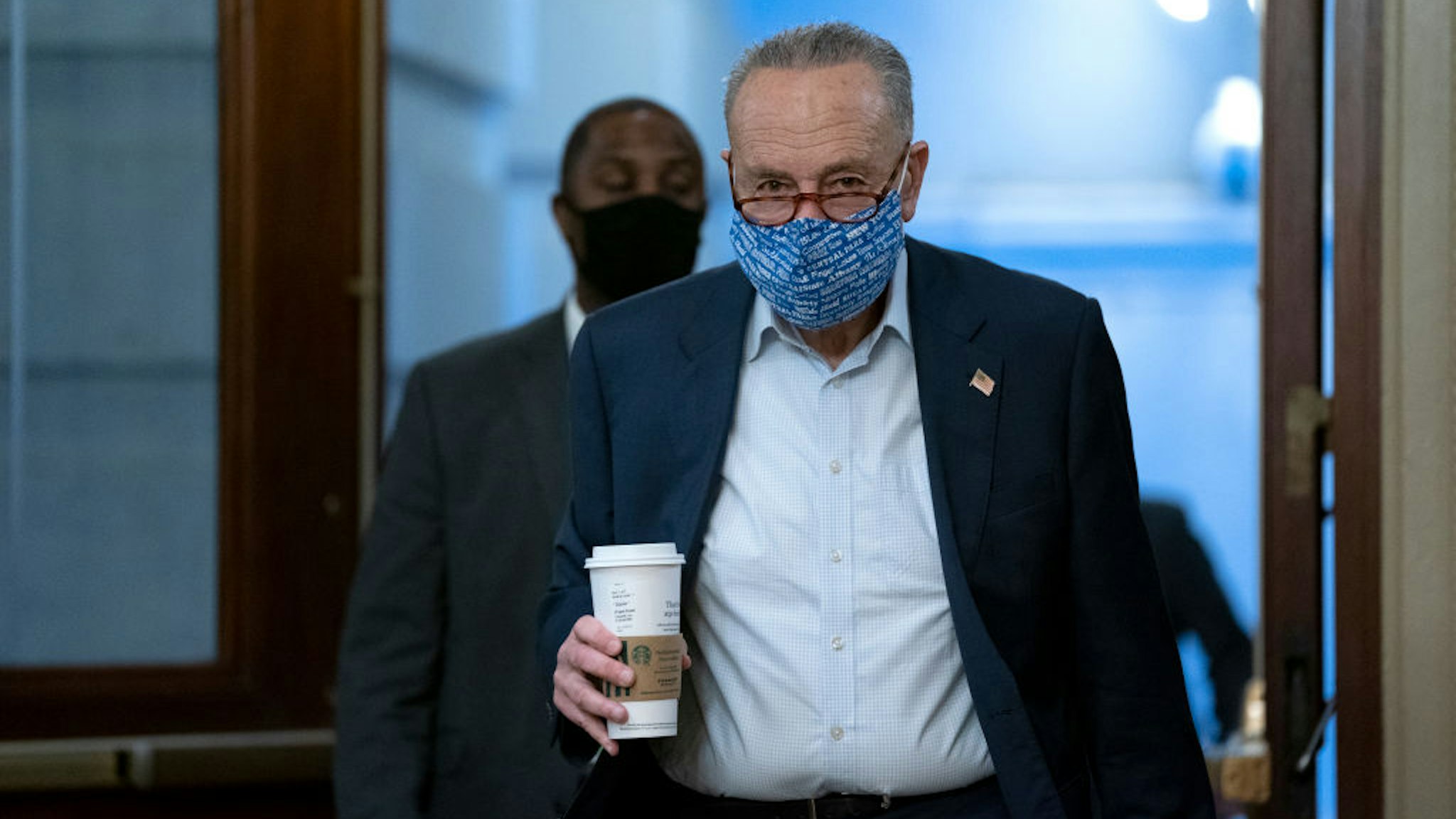 WASHINGTON, DC - OCTOBER 20: U.S. Senate Minority Leader Chuck Schumer (D-NY), right, wears a protective mask as he arrives to the U.S. Capitol on October 20, 2020 in Washington, DC. Senate Republicans are looking to hold a confirmation vote for Supreme Court nominee Amy Coney Barrett on Monday, October 26, approximately one week before the Presidential election.(Photo by Stefani Reynolds/Getty Images)