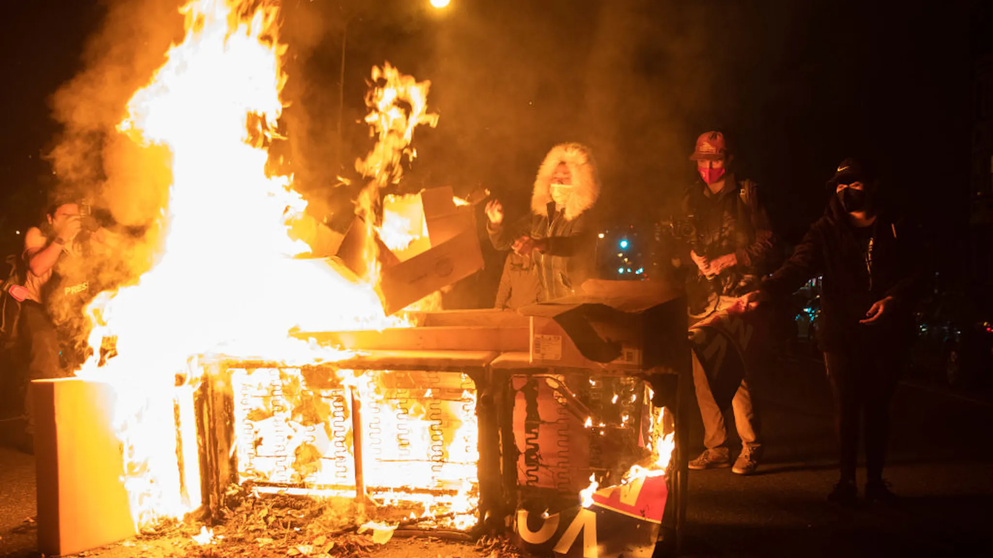 US-POLICE-VOTE-PROTEST Protesters set a sofa on fire in West Philadelphia on October 27, 2020, during a demonstration against the fatal shooting of 27-year-old Walter Wallace, a Black man, by police.
