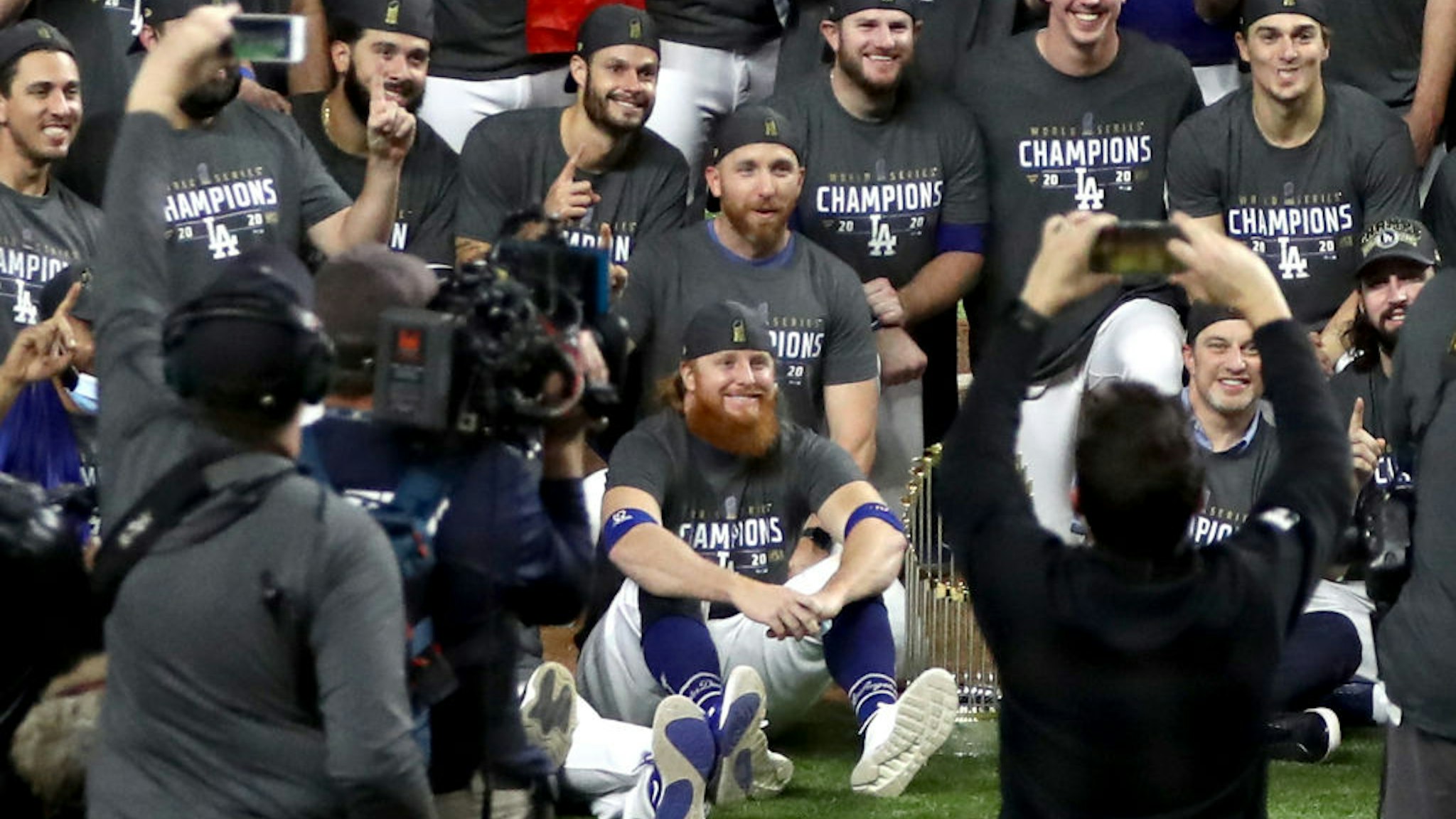 ustin Turner #10 and the Los Angeles Dodgers pose for a photo after defeating the Tampa Bay Rays 3-1 in Game Six to win the 2020 MLB World Series at Globe Life Field on October 27, 2020 in Arlington, Texas.