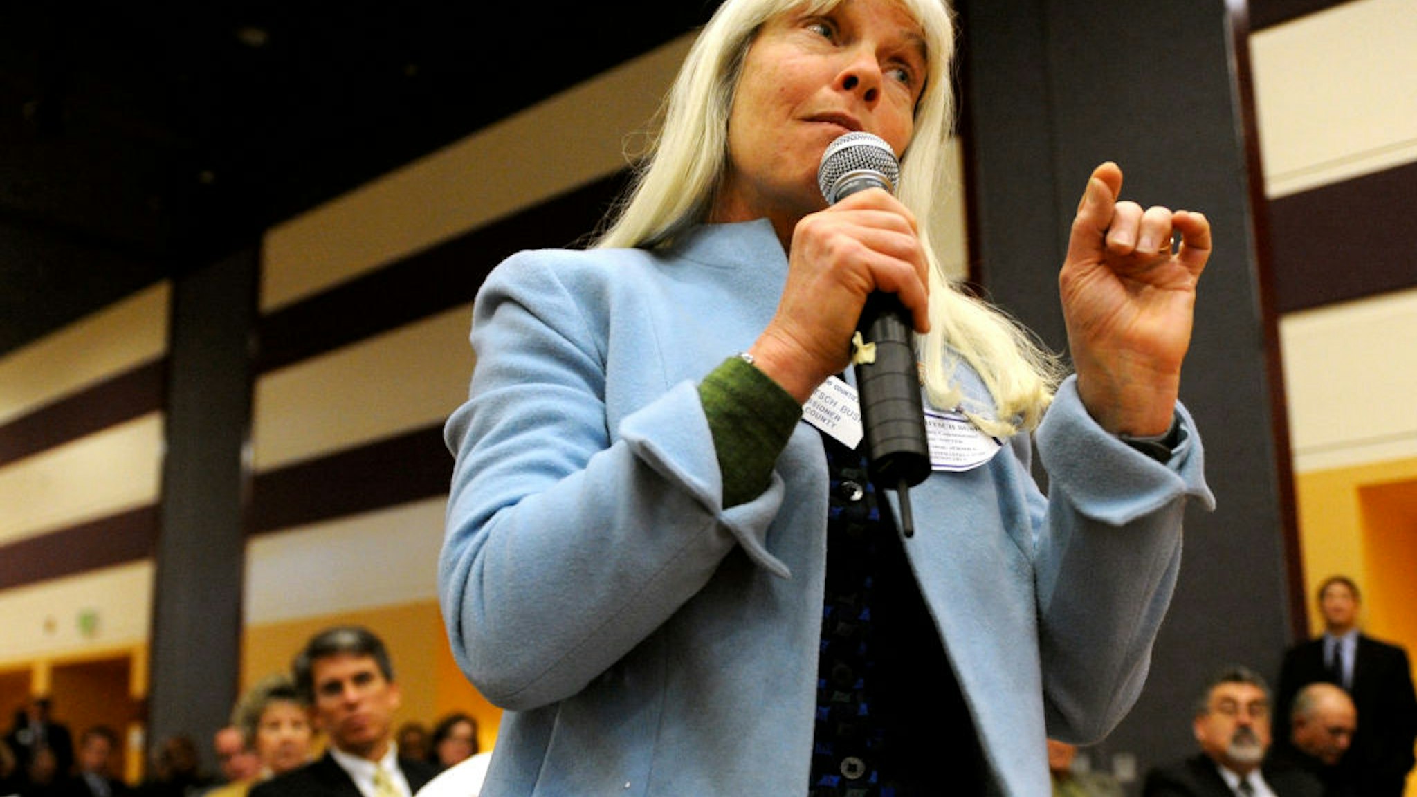 Routt County Commissioner Diane Mitsch Bush asks a question of keynote speaker U.S. Transportation Secretary Ray LaHood during the Q&A portion of the "Putting Colorado to Work" jobs forum at the University of Denver.