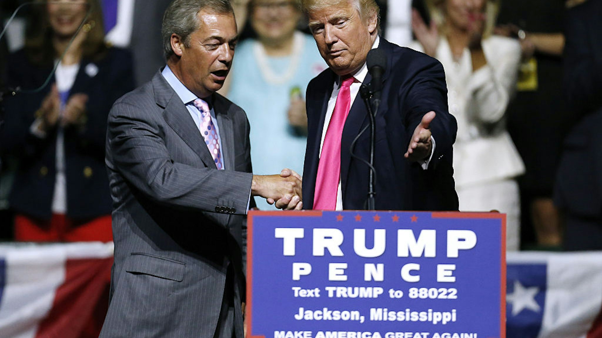 Republican Presidential nominee Donald Trump, right, invites United Kingdom Independence Party leader Nigel Farage to speak during a campaign rally at the Mississippi Coliseum on August 24, 2016 in Jackson, Mississippi.