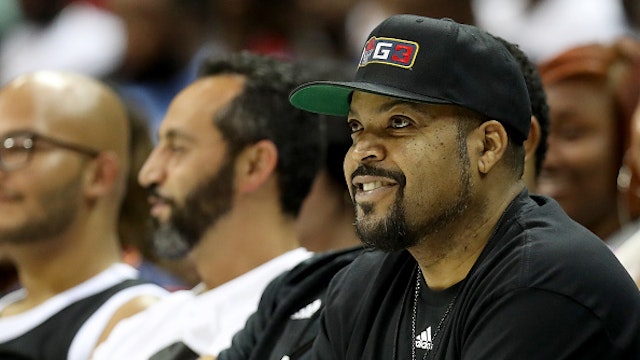 CHARLOTTE, NORTH CAROLINA - JUNE 29: Ice Cube watches the game between Triplets and Trilogy during week two of the BIG3 three on three basketball league at Spectrum Center on June 29, 2019 in Charlotte, North Carolina.