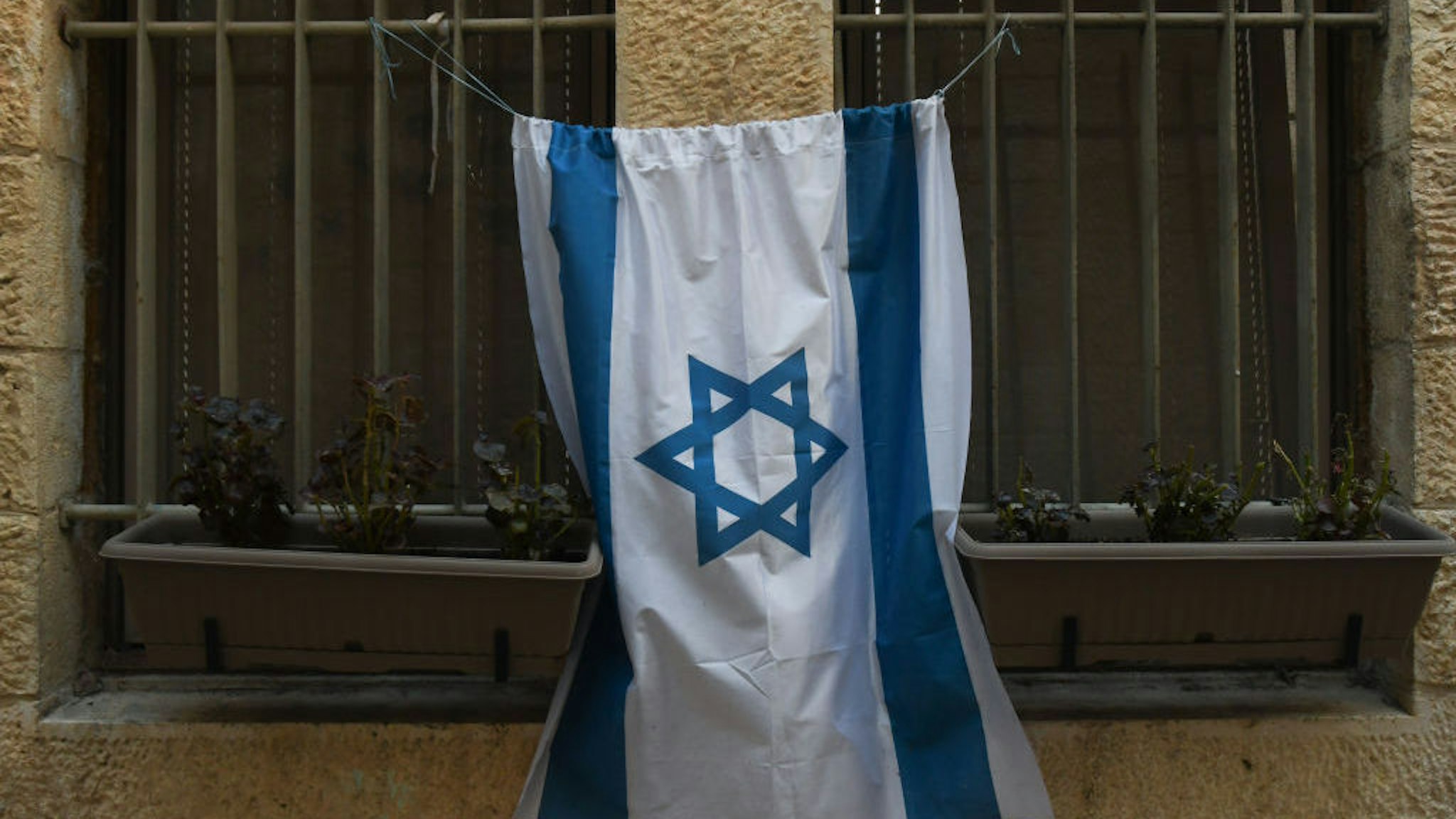 An Israeli flag seen on a house in Jerusalem's Old City. On Friday, February 28, 2020, in Jerusalem, Israel. (Photo by Artur Widak/NurPhoto via Getty Images)