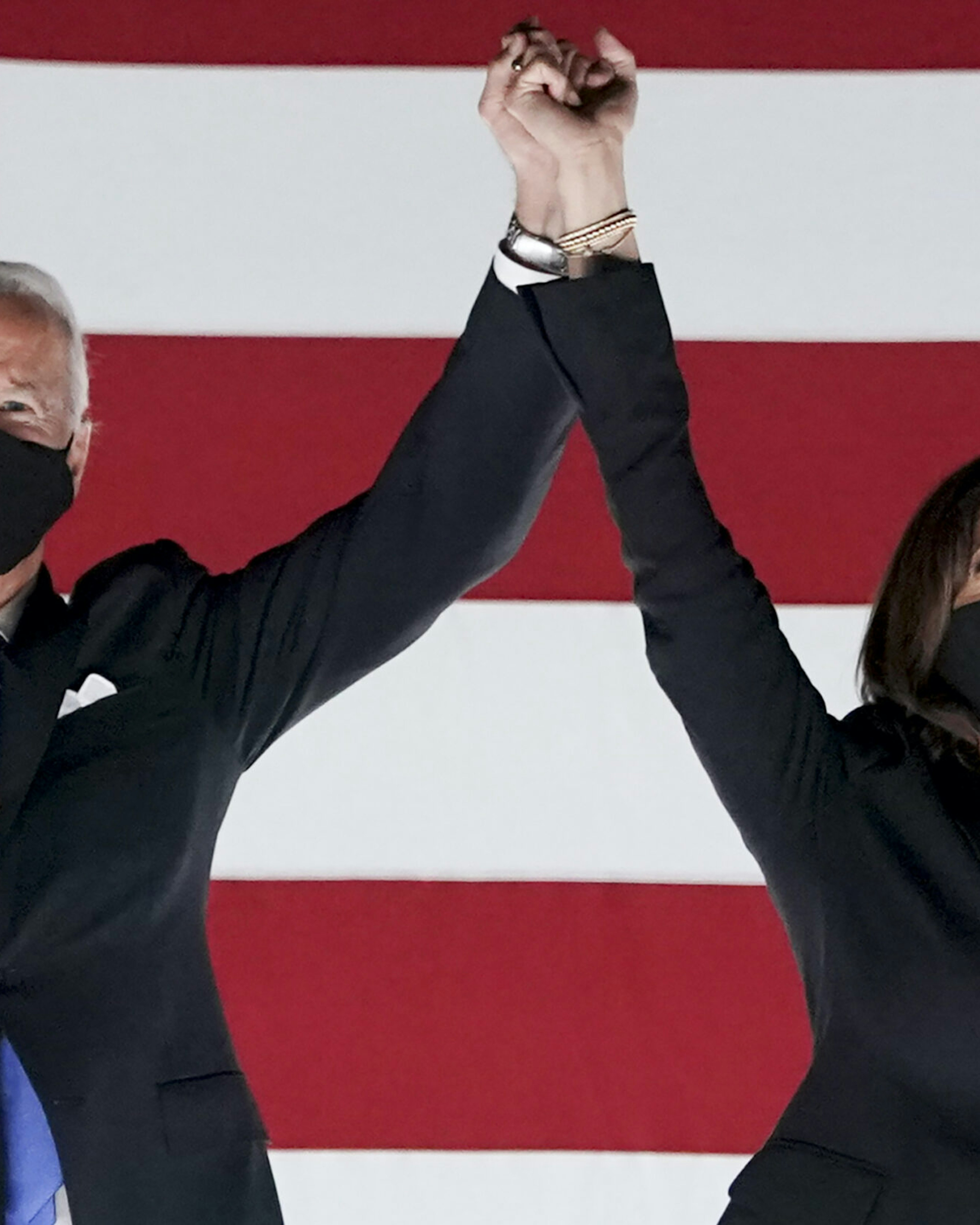 Former Vice President Joe Biden, Democratic presidential nominee, left, and Senator Kamala Harris, Democratic vice presidential nominee, wear protective masks while holding hands outside the Chase Center during the Democratic National Convention in Wilmington, Delaware, U.S., on Thursday, Aug. 20, 2020. Biden accepted the Democratic nomination to challenge President Donald Trump, urging Americans in a prime-time address to vote for new national leadership that will overcome deep U.S. political divisions. Photographer: Stefani Reynolds/Bloomberg