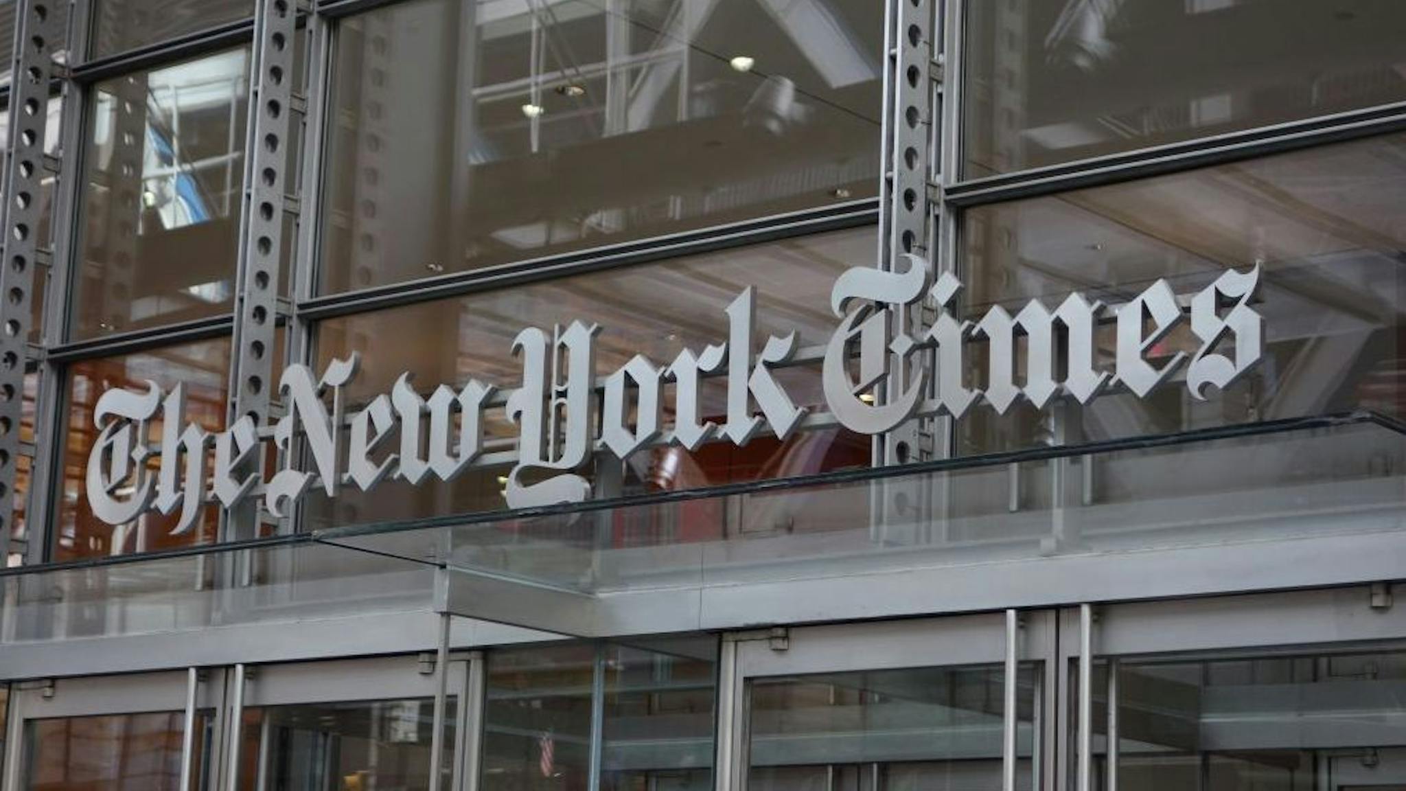 New York Times building The sign over the west entrance of the New York Times building at 620 Eighth Ave. April 28, 2016 in New York. (Photo by Don EMMERT / AFP)