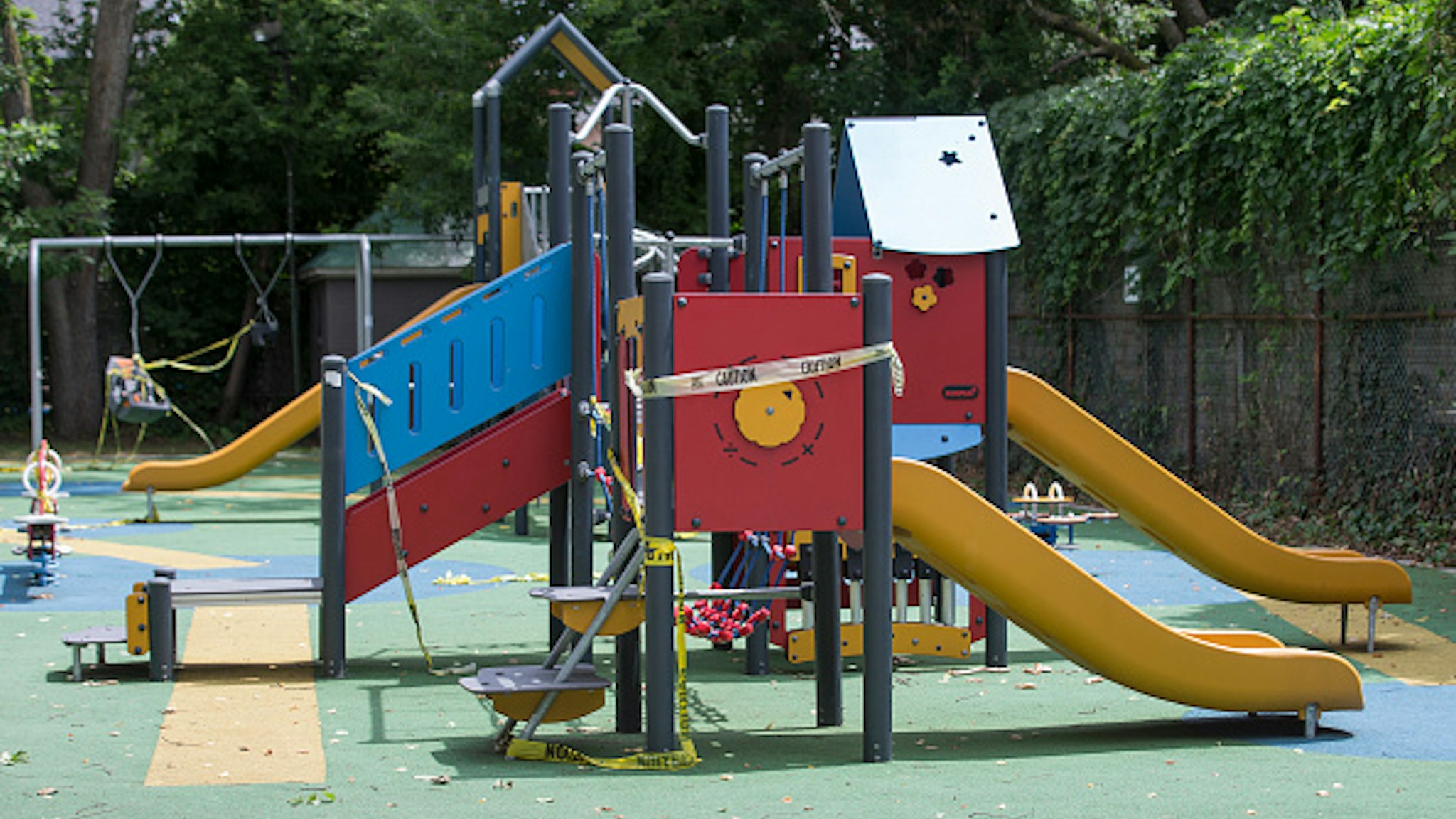 TORONTO, ON - JULY 13: Much of the tape on the play equipment at Cathraw Playground, in midtown, is in disarray and may need to be restrung now that it is clear childrens playgrounds will remain closed during Phase 3 of the reopening. COVID-19. CORONAPD Toronto Star/Rick Madonik