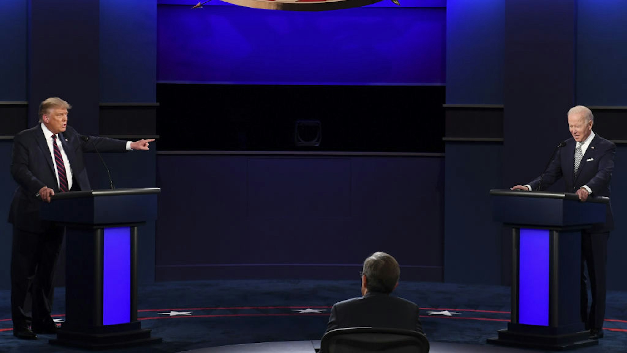 U.S. President Donald Trump, left, speaks as Joe Biden, 2020 Democratic presidential nominee, listens during the first U.S. presidential debate hosted by Case Western Reserve University and the Cleveland Clinic in Cleveland, Ohio, U.S., on Tuesday, Sept. 29, 2020. Trump and Biden kick off their first debate with contentious topics like the Supreme Court and the coronavirus pandemic suddenly joined by yet another potentially explosive question -- whether the president ducked paying his taxes. Photographer: Kevin Dietsch/UPI/Bloomberg via Getty Images