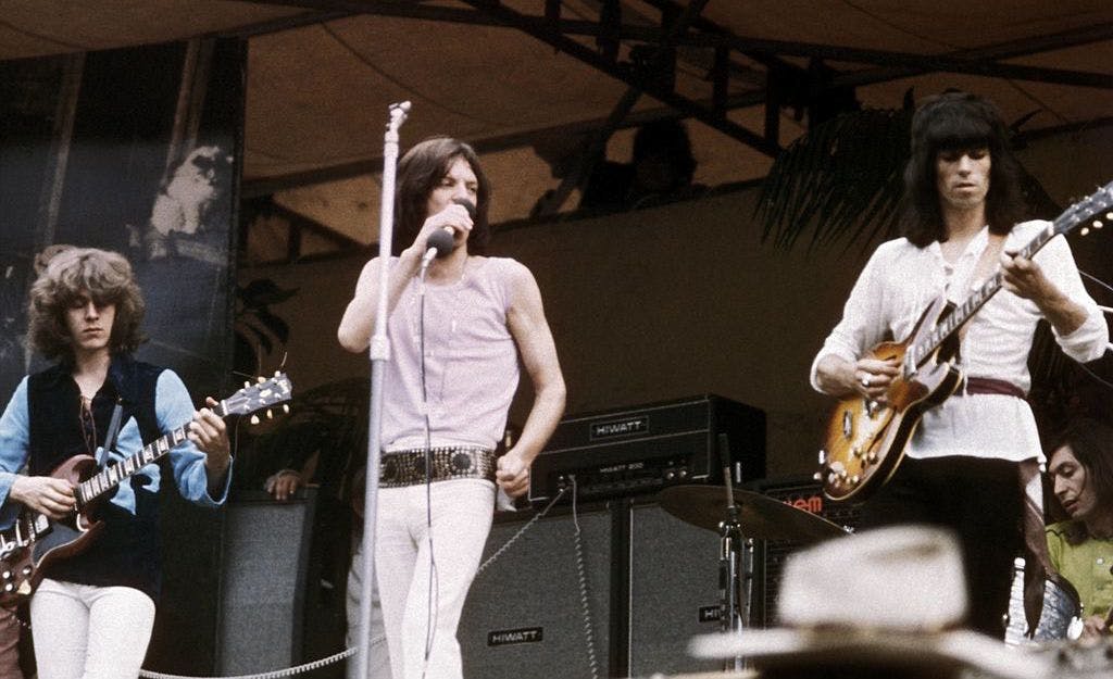 UNITED KINGDOM - JULY 05: HYDE PARK Photo of Mick JAGGER and Mick TAYLOR and ROLLING STONES and Keith RICHARDS, L-R: Mick Taylor, Mick Jagger, Keith Richards (playing Gibson ES-330 guitar) performing live onstage at free Hyde Park concert (Photo by RB/Redferns)