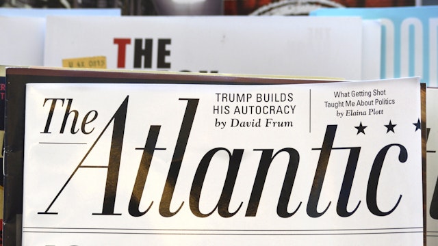 SAN FRANCISCO, CALIFORNIA - SEPTEMBER 16, 2018: A rack of magazines, including The Atlantic, on display in a bookstore in San Francisco, California. The Atlantic cover story promo asks 'Is Democracy Dying?' In 2017, billionaire investor and philanthropist Laurene Powell Jobs, widow of Steve Jobs, acquired majority ownership of the magazine.