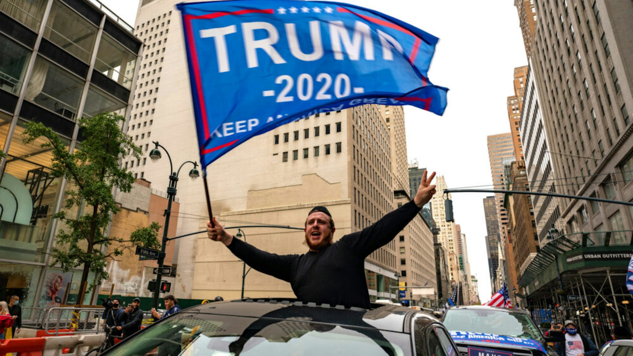 NEW YORK, NY - OCTOBER 25: A person participates in a march and rally for President Donald Trump on 5th Avenue on October 25, 2020 in New York City. As the November 3rd presidential election nears, Trump supporters and protestors have taken to the streets to be heard.