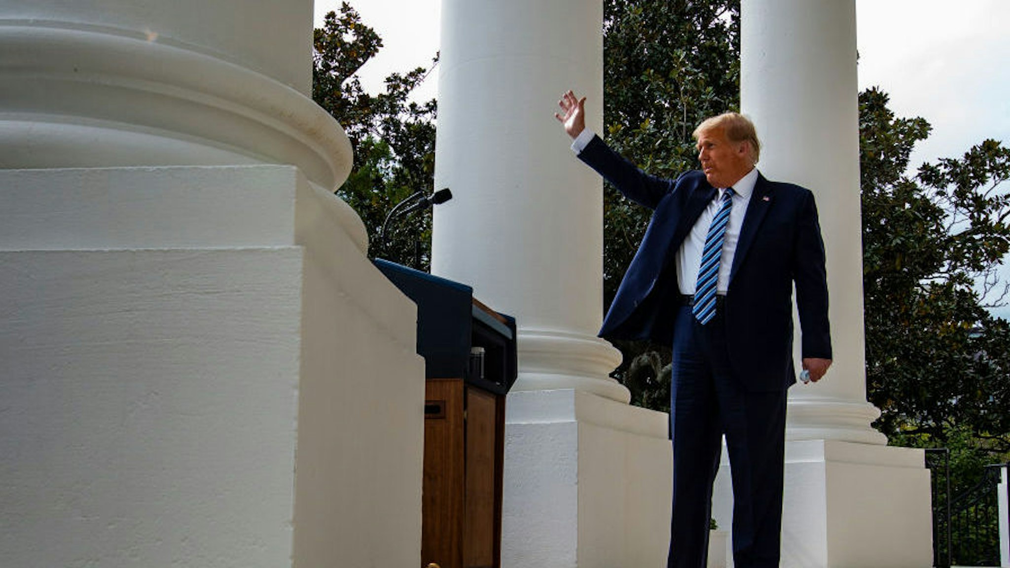 WASHINGTON, DC - OCTOBER 10: U.S. President Donald Trump waves after addressing a rally in support of law and order on the South Lawn of the White House on October 10, 2020 in Washington, DC. The President is making his first in-person appearance after being cleared by his doctors following his diagnosis and treatment of the coronavirus approximately 10 days ago.