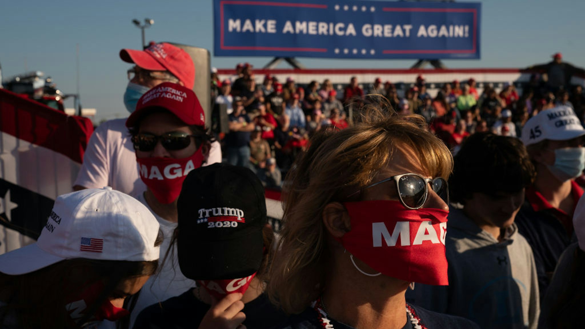 Attendees wait to hear President Trump speaks at a campaign rally on October 16, 2020 in Macon, Georgia. President Trump continues to campaign against Democratic presidential nominee Joe Biden with 18 days until election day. (Photo by Elijah Nouvelage/Getty Images)