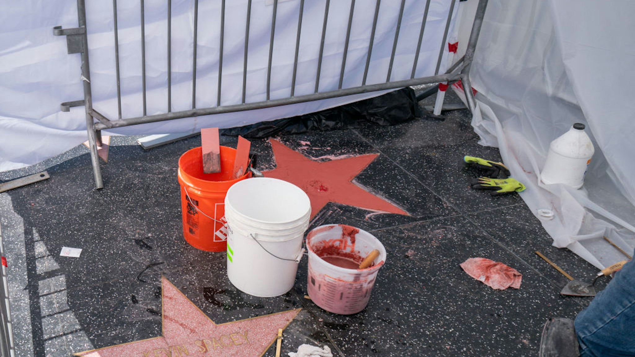 HOLLYWOOD, CA - OCTOBER 02: Workers respond to reforge Donald Trump's star on the Walk of Fame after it was destroyed by vandals early Friday morning on October 02, 2020 in Hollywood, California.
