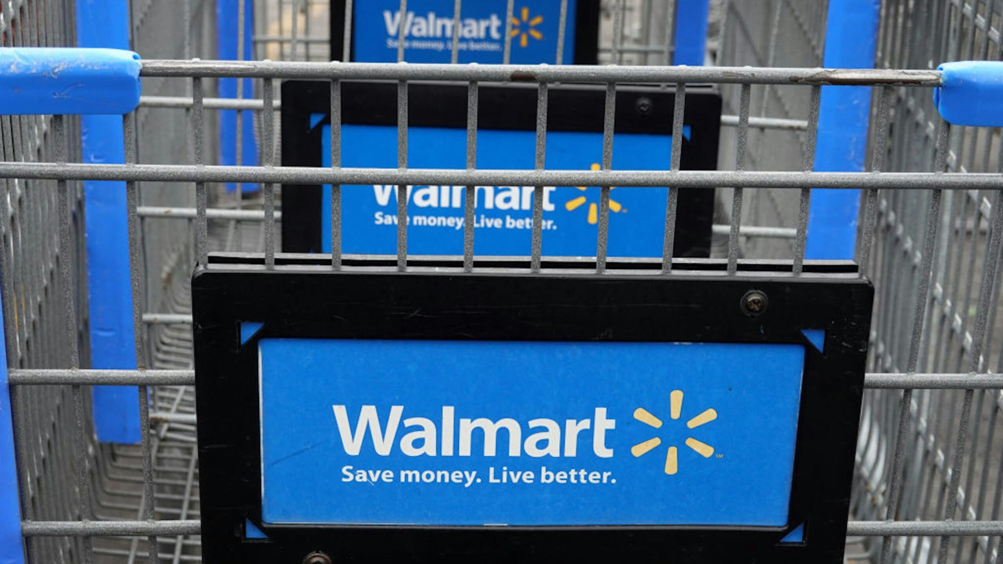 CHICAGO, ILLINOIS - MAY 19: Shopping carts sit in the parking lot of a Walmart store on May 19, 2020 in Chicago, Illinois. Walmart reported a 74% increase in U.S. online sales for the quarter that ended April 30, and a 10% increase in same store sales for the same period as the effects of the coronavirus helped to boost sales.